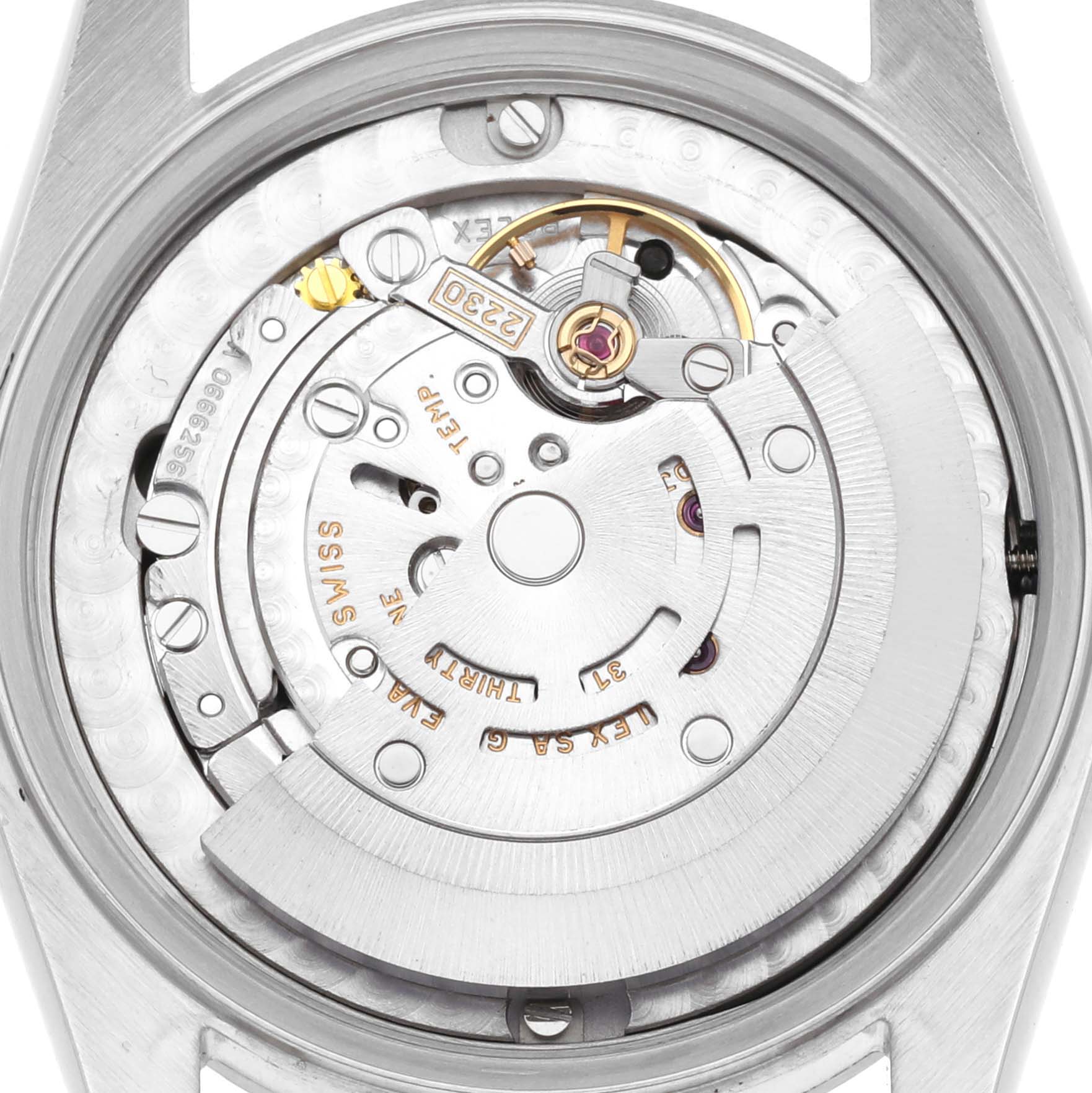 The image shows a close-up of the movement inside a Rolex Mid-Size 77080 Women's Stainless Steel Black Dial 77080 Women's Stainless Steel Black Dial watch from a top-down angle.