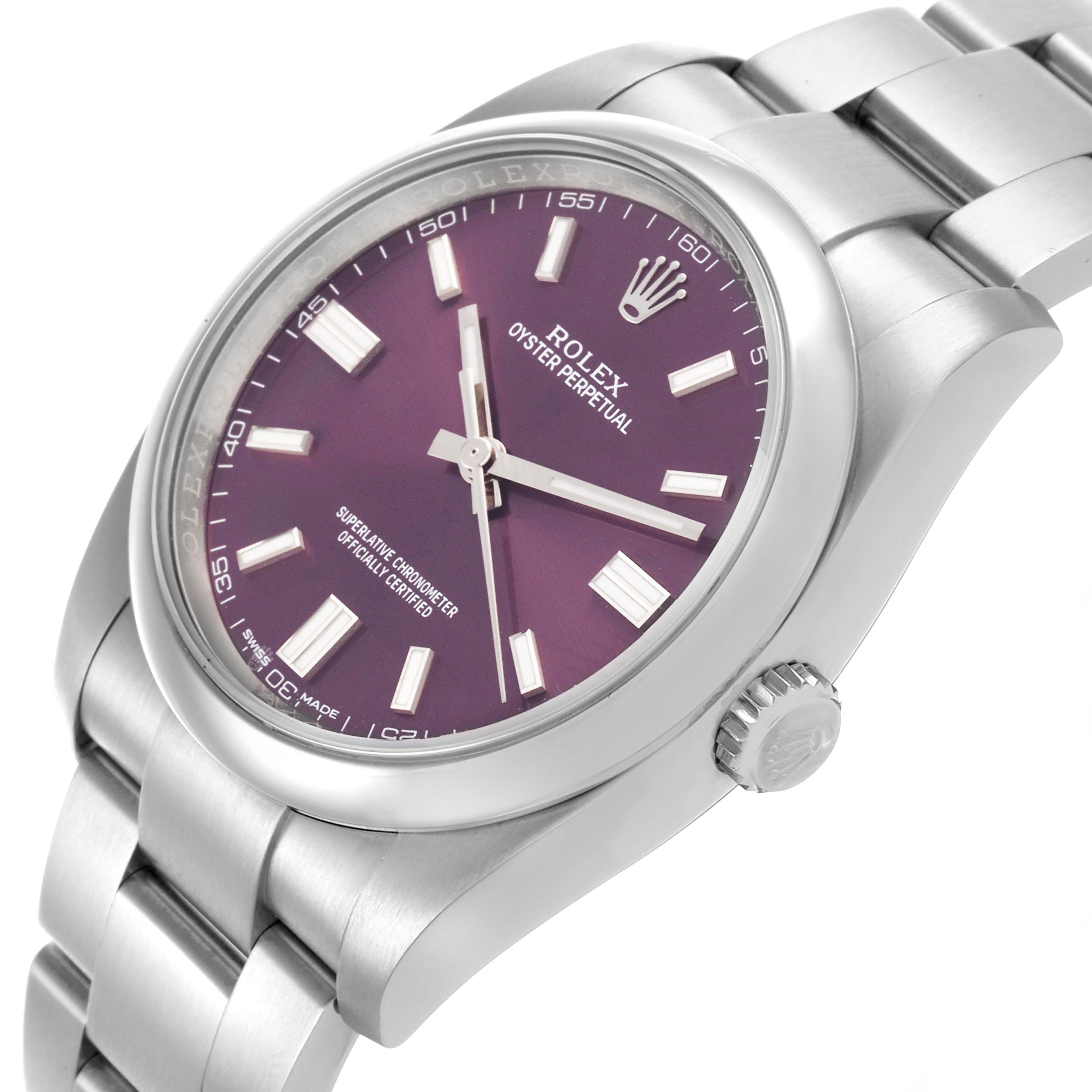 The Rolex Oyster Perpetual 116000 Men's Stainless Steel Purple Dial watch is shown at an oblique angle, highlighting its purple dial, crown, and stainless steel bracelet.