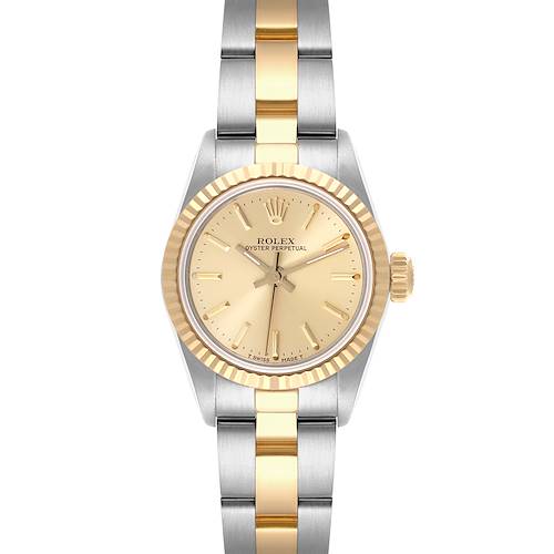 The Rolex Oyster Perpetual watch is shown from a top-down angle, displaying its gold and silver bezel and bracelet.