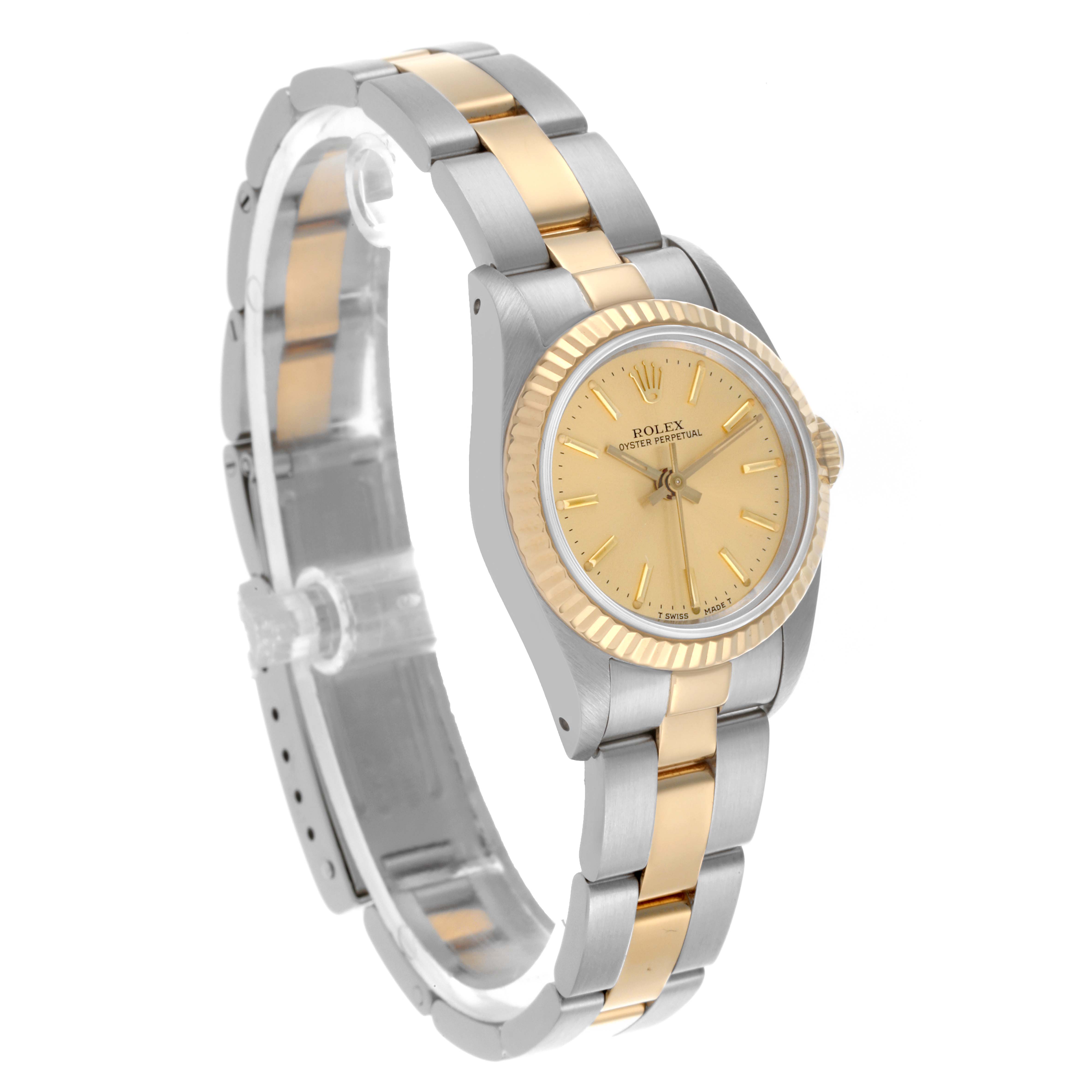 The Rolex Oyster Perpetual 67193 Women's Steel and Gold (two tone) Champagne Dial 67193 Women's Steel and Gold (two tone) Champagne Dial watch is shown at a three-quarter angle, highlighting its case, bezel, dial, and bracelet.