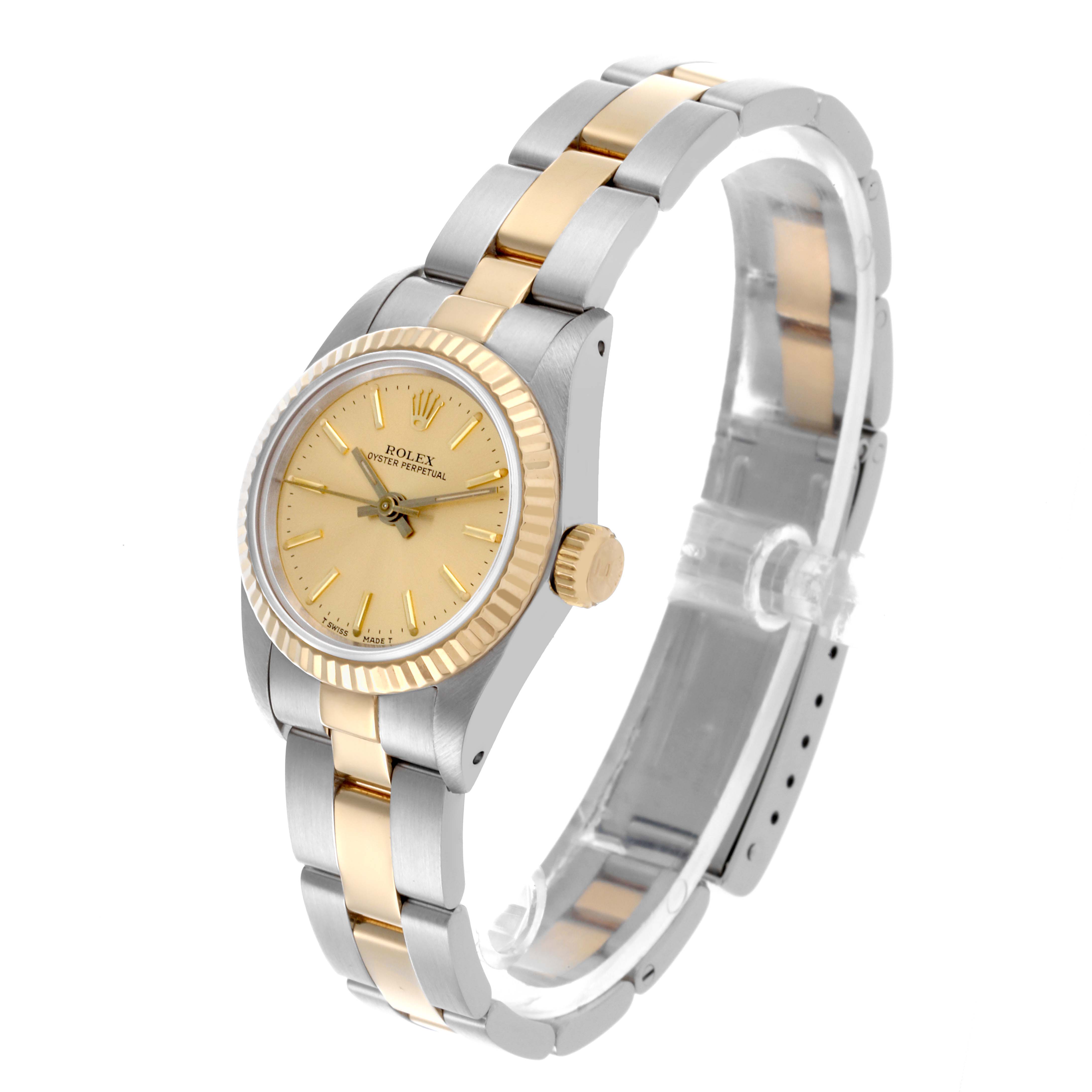 The Rolex Oyster Perpetual 67193 Women's Steel and Gold (two tone) Champagne Dial 67193 Women's Steel and Gold (two tone) Champagne Dial watch is shown at a three-quarter angle, displaying the face, bezel, crown, and part of the bracelet.