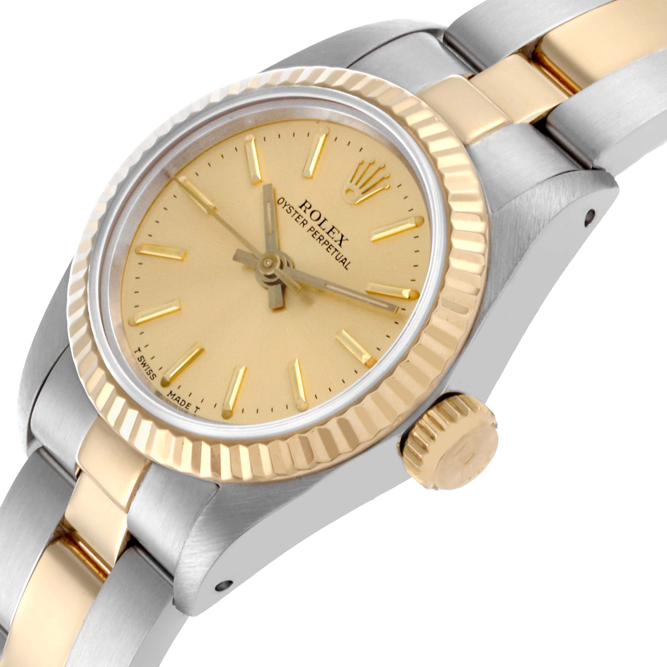 The Rolex Oyster Perpetual 67193 Women's Steel and Gold (two tone) Champagne Dial 67193 Women's Steel and Gold (two tone) Champagne Dial watch is shown from an angled side view featuring its gold bezel, crown, and two-tone bracelet.