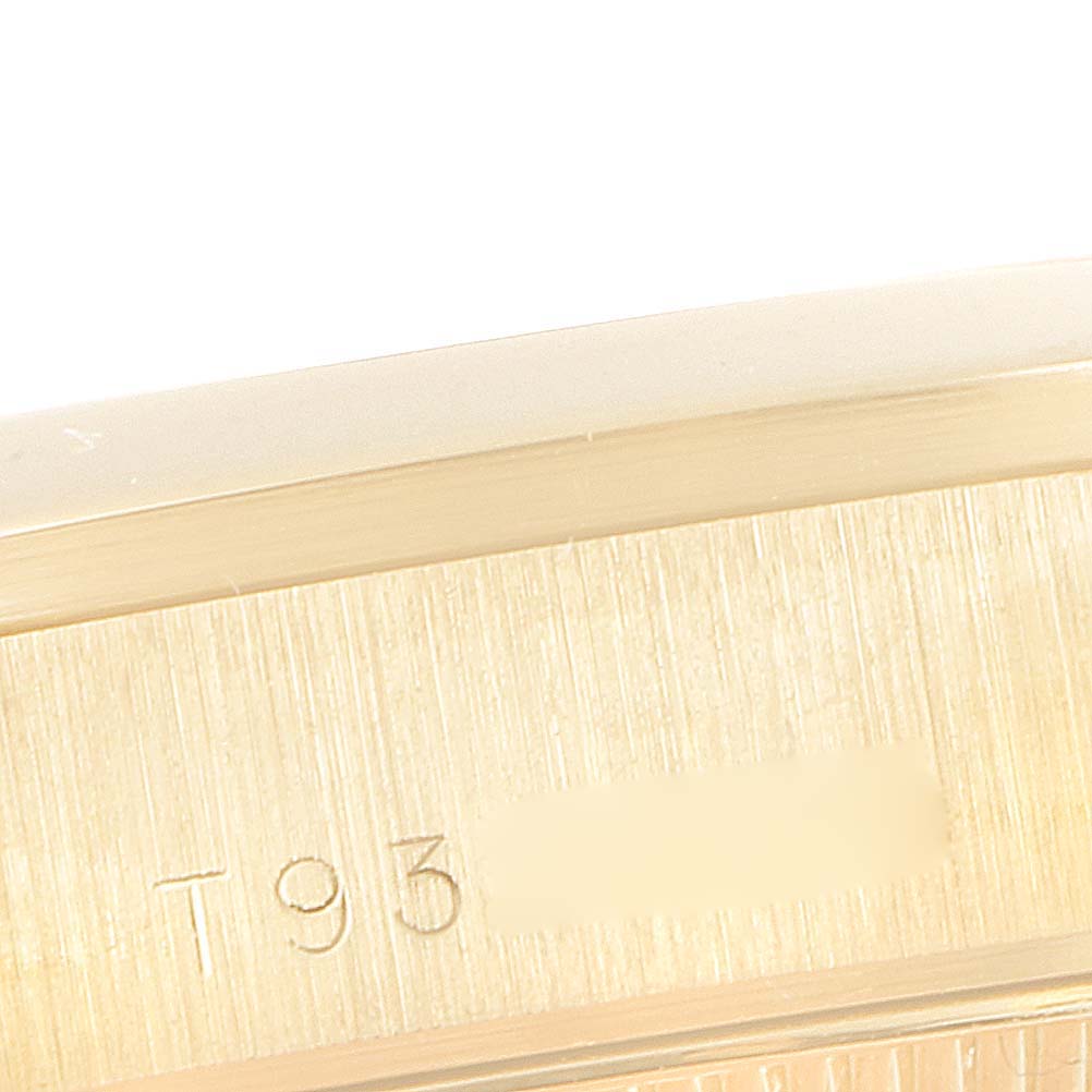 This image shows a close-up of the engraved side of the case of a Rolex President 68248 Women
s Yellow Gold Beige Dial 68248 Women
s Yellow Gold Beige Dial model watch.