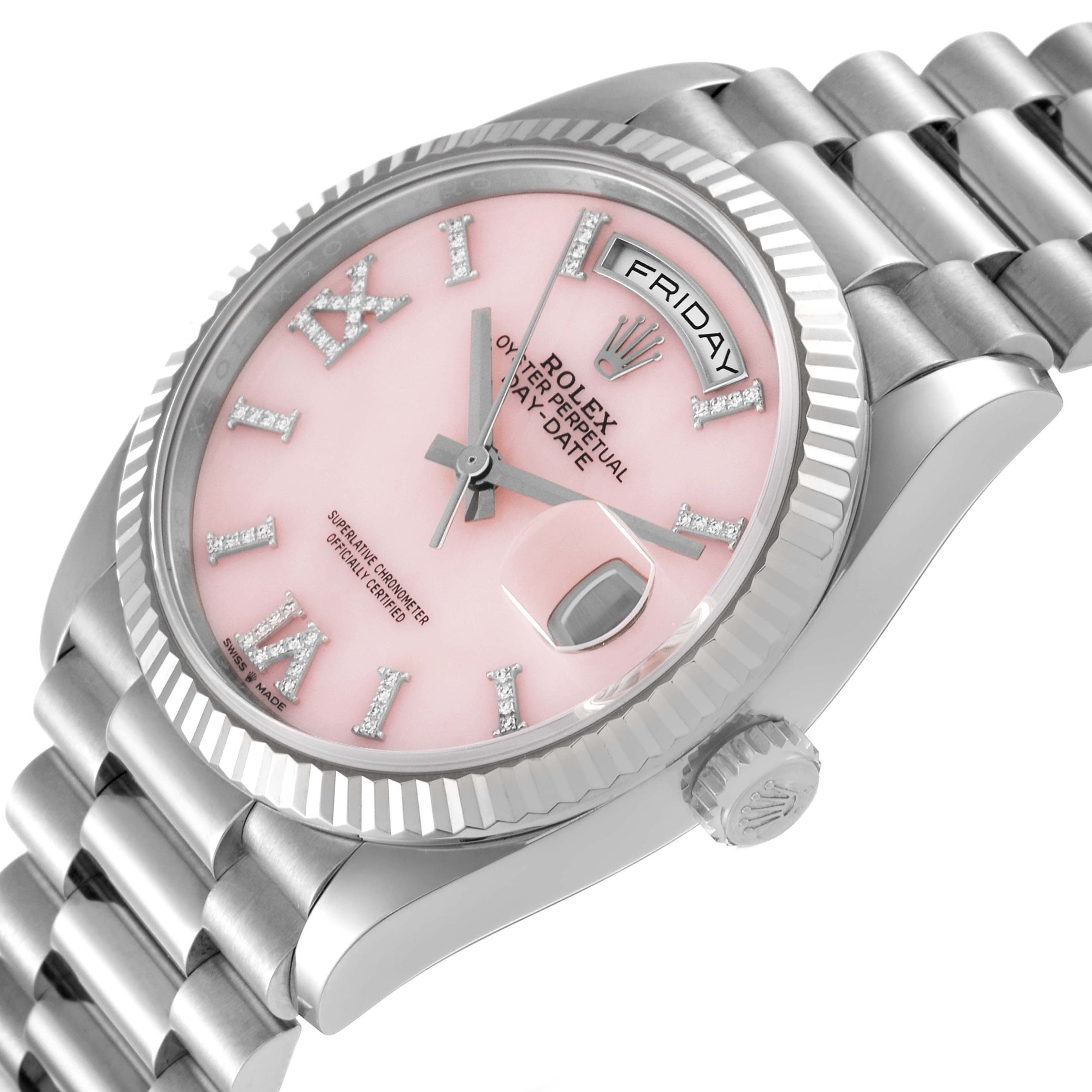 The Rolex President 128239 Men's White Gold Pink Dial 128239 Men's White Gold Pink Dial watch is shown at a three-quarter angle, displaying the pink dial, fluted bezel, day/date windows, and bracelet.