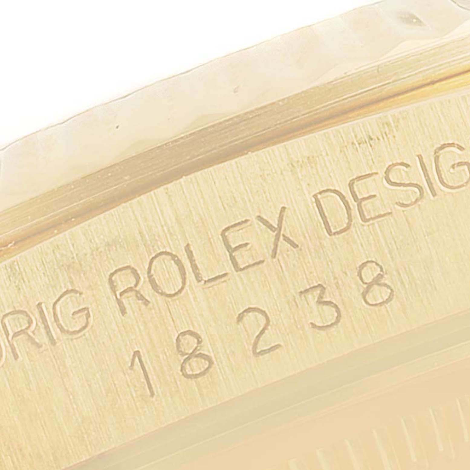 The image shows a close-up of the engraved model number "18238" on the President model by Rolex.
