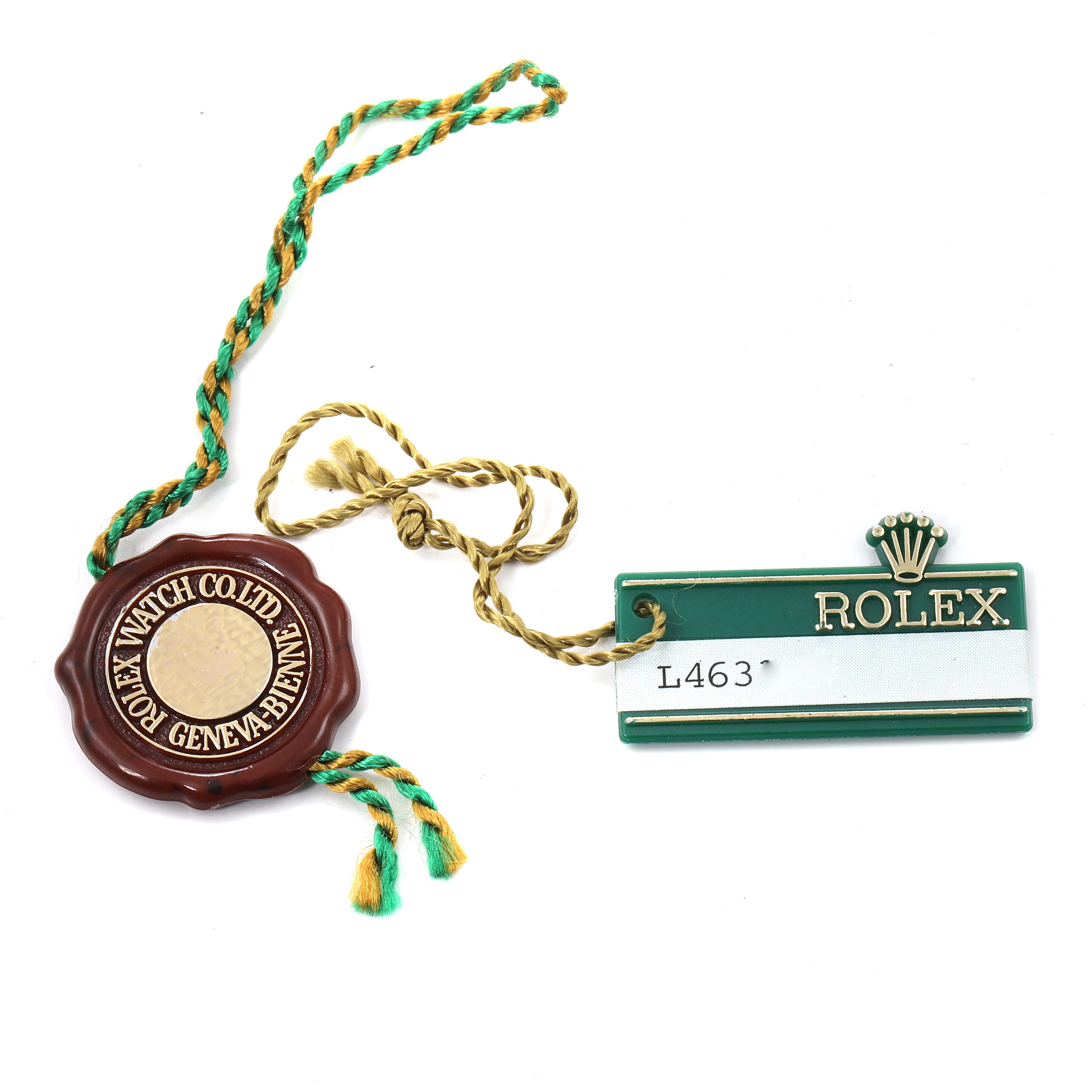 This image shows tags and seals from a Rolex President 18238 Men's Yellow Gold Champagne Dial 18238 Men's Yellow Gold Champagne Dial model watch, featuring the brand's logo and details.