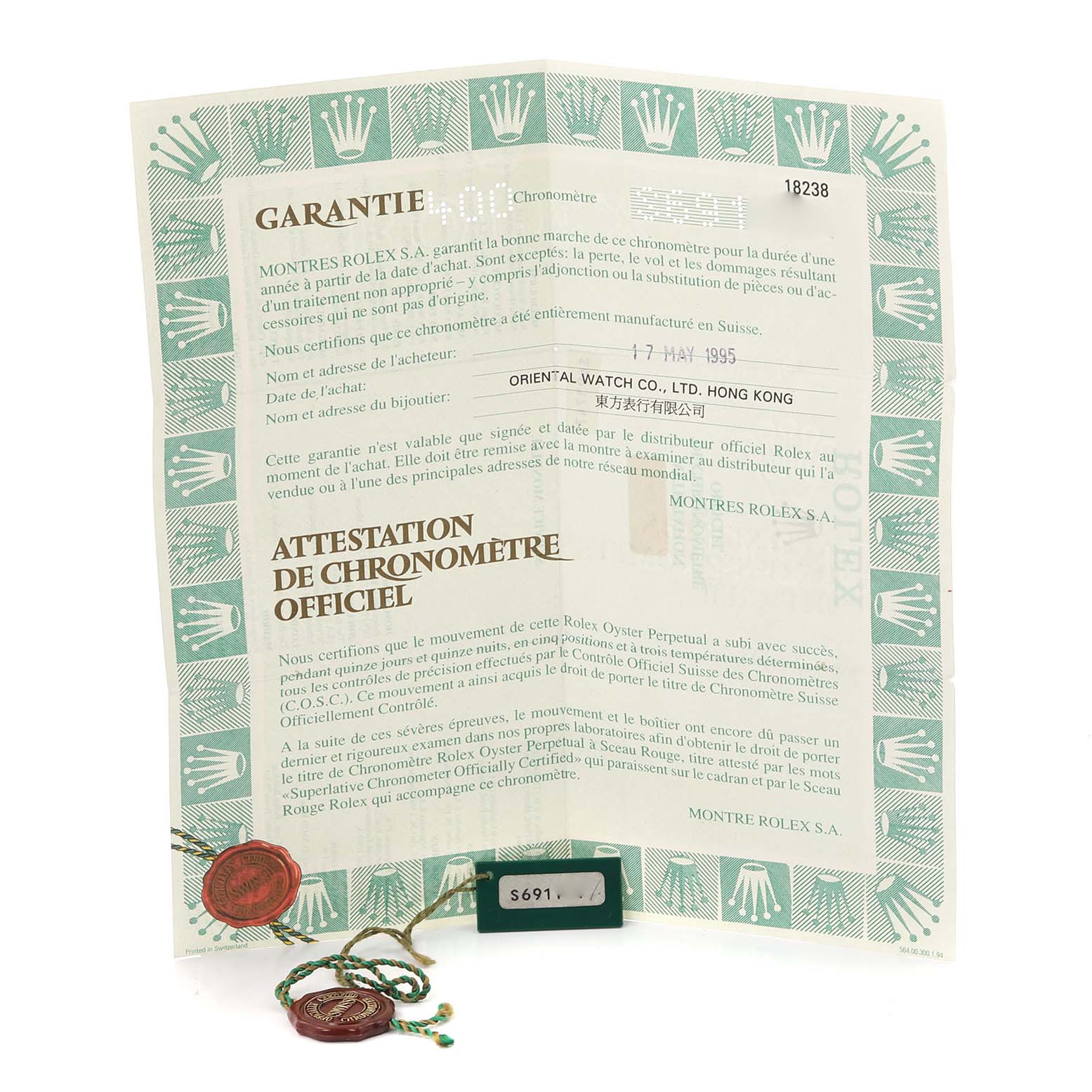 The image shows the warranty and chronometer certificate for a Rolex President 18238 Men's Yellow Gold Silver Dial 18238 Men's Yellow Gold Silver Dial model, including tag and seal.