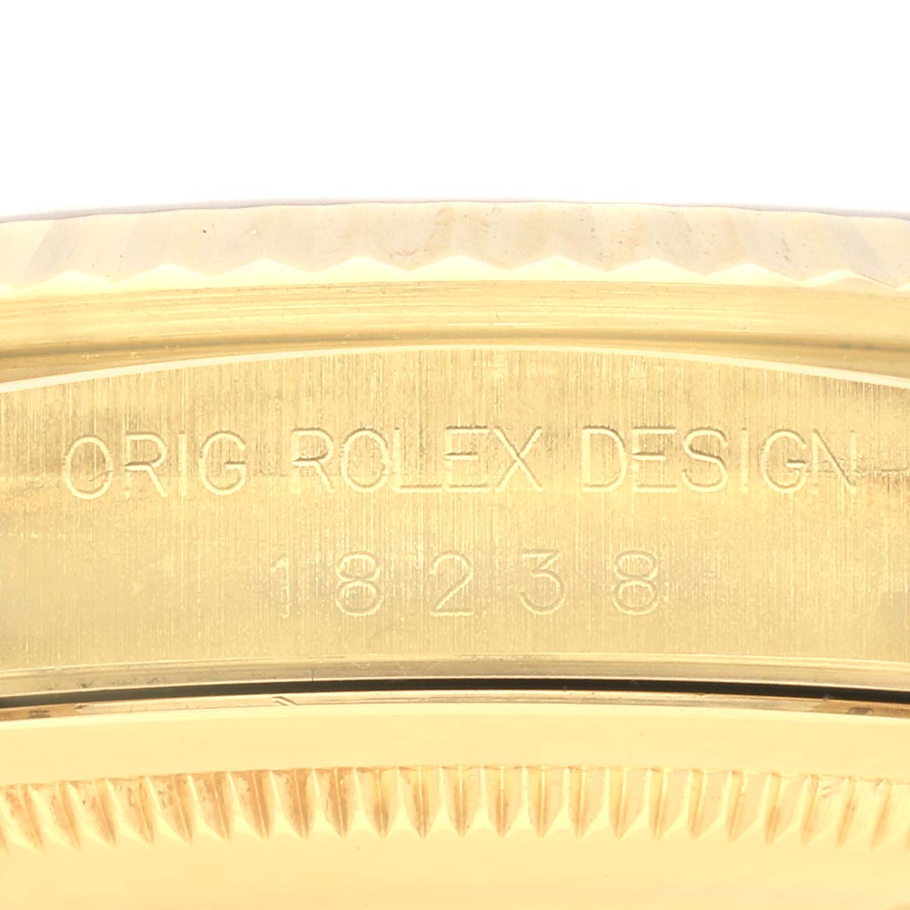 The image shows a close-up of the Rolex President 18238 Men's Yellow Gold Silver Dial 18238 Men's Yellow Gold Silver Dial model's engraved inner bezel.