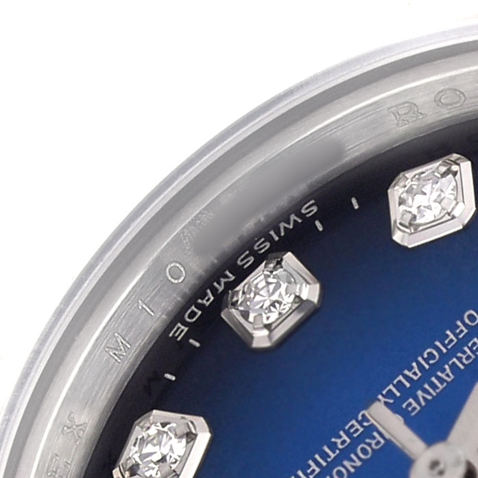 The image shows a close-up of the Rolex President 179166 Women's Platinum Blue Dial watch face, highlighting the diamond hour markers and part of the bezel.