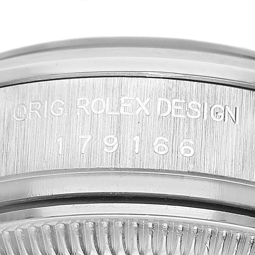 The image shows a close-up of the serial and model number on a Rolex President 179166 Women's Platinum Blue Dial watch case.