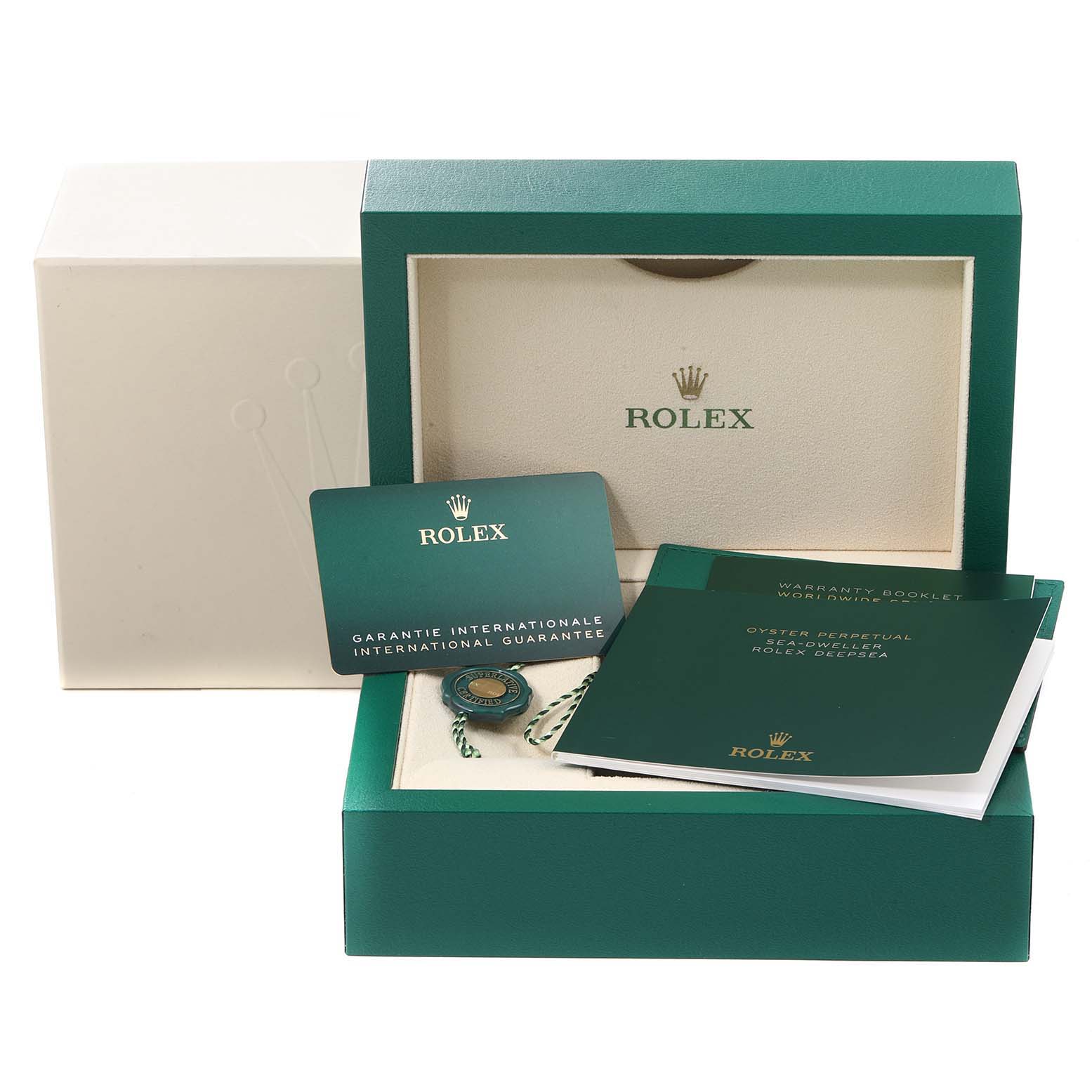 This image shows the packaging, warranty card, booklet, and accessories for a Rolex Sea-Dweller 126600 Men
s Stainless Steel Black Dial 126600 Men
s Stainless Steel Black Dial watch.