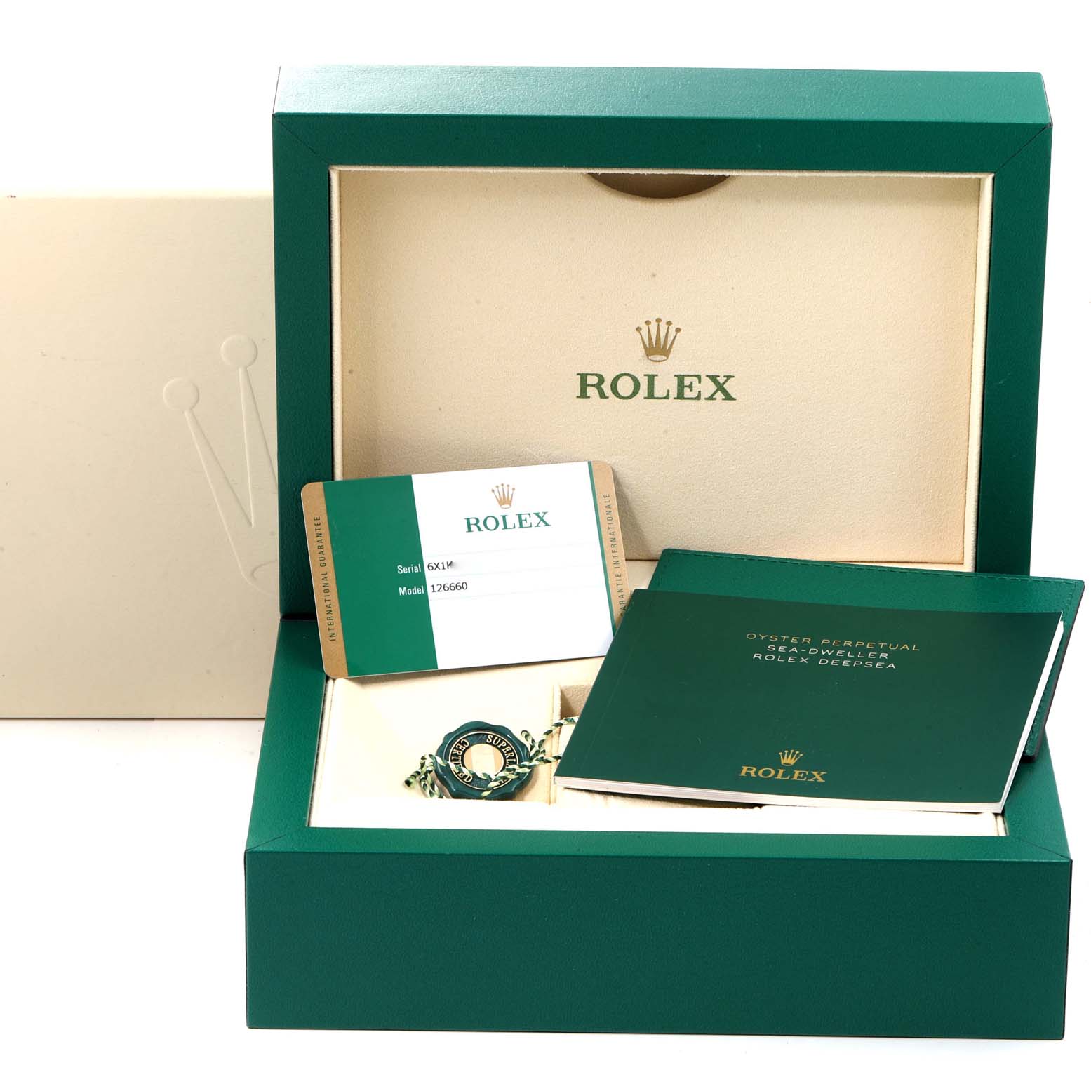 This image shows the packaging and accessories for the Rolex Sea-Dweller 126660 Men
s Stainless Steel Blue Dial 126660 Men
s Stainless Steel Blue Dial model, including the box, warranty card, and manuals.