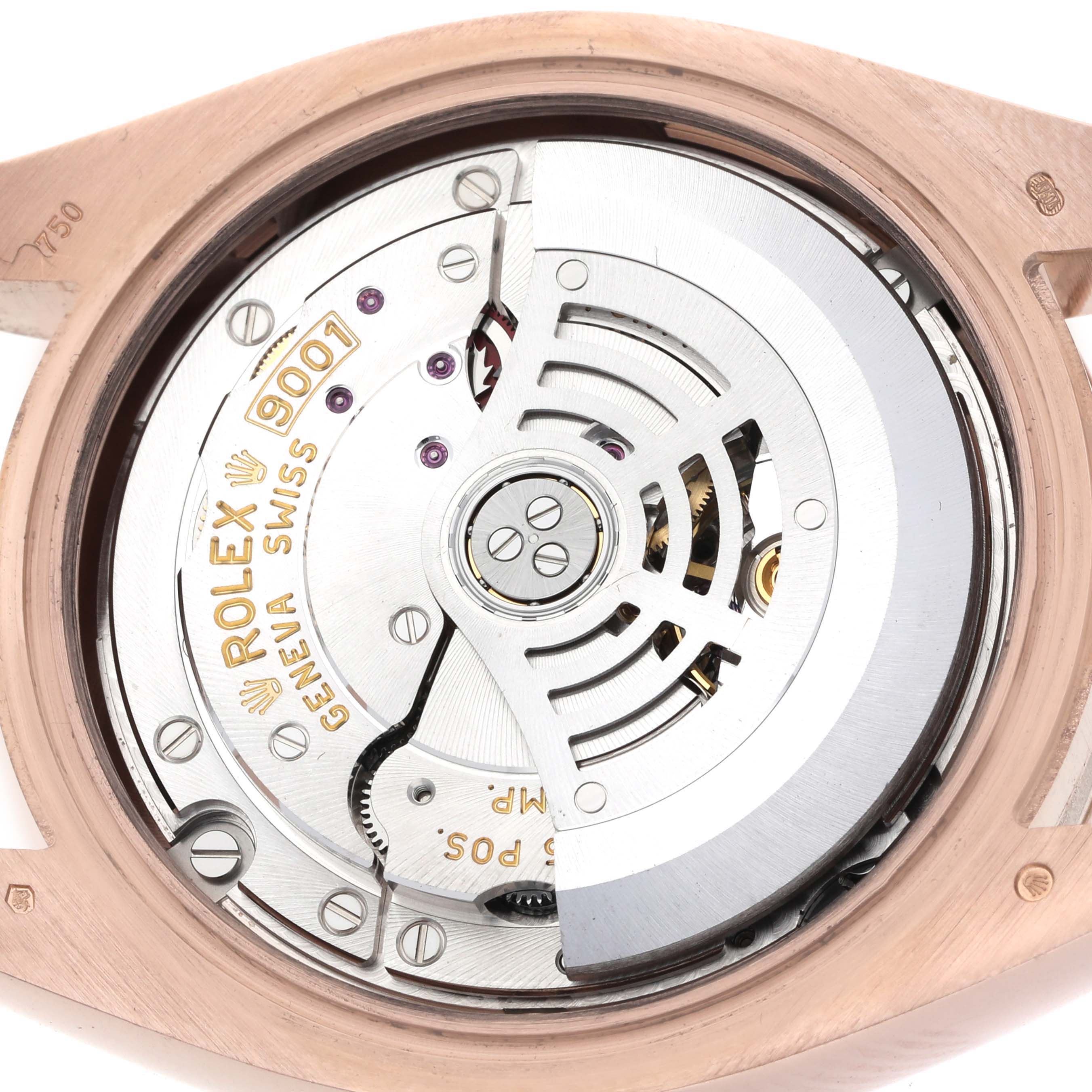 The image shows a top view of the Rolex Sky-Dweller 326935 Men's Rose Gold Brown Dial's movement with its rotor and engraved details visible.