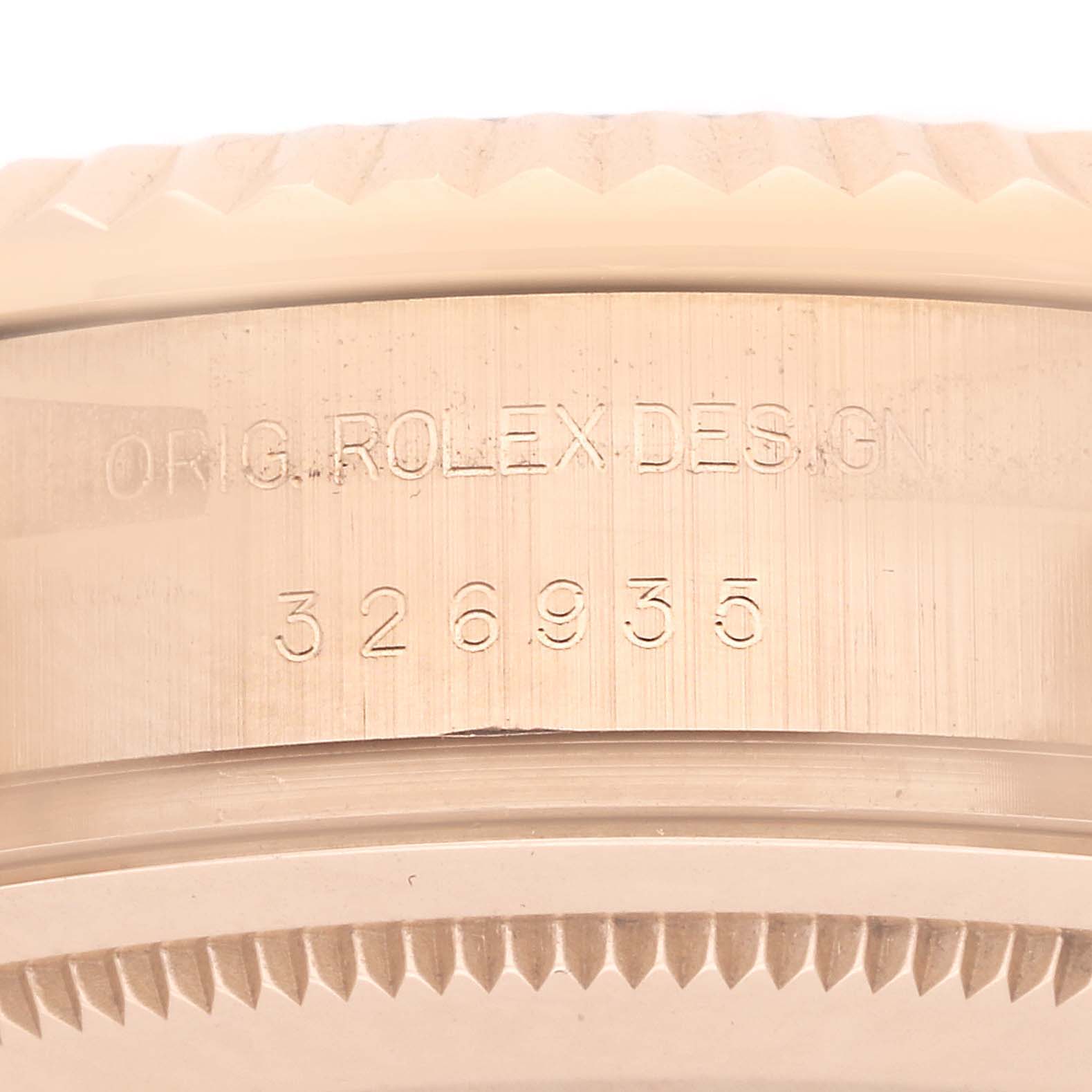 The image shows a close-up of the Rolex Sky-Dweller 326935 Men's Rose Gold Brown Dial's case, focusing on the engraved model number and "ORIG. ROLEX DESIGN".