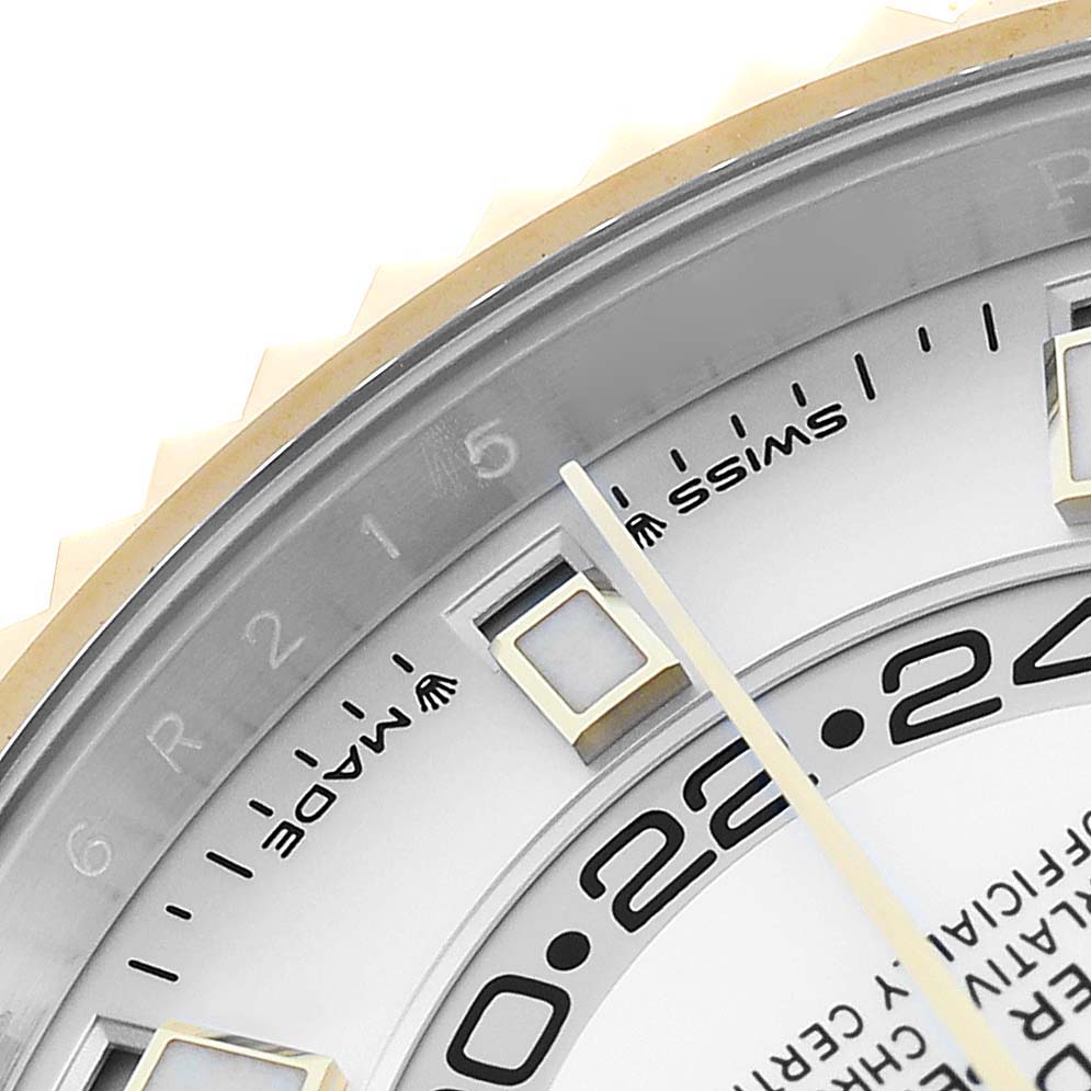 The image shows a close-up of the Rolex Sky-Dweller 336933 Men
s Steel and Gold (two tone) Silver Dial
s watch face, highlighting the bezel, hour markers, and date indicator.