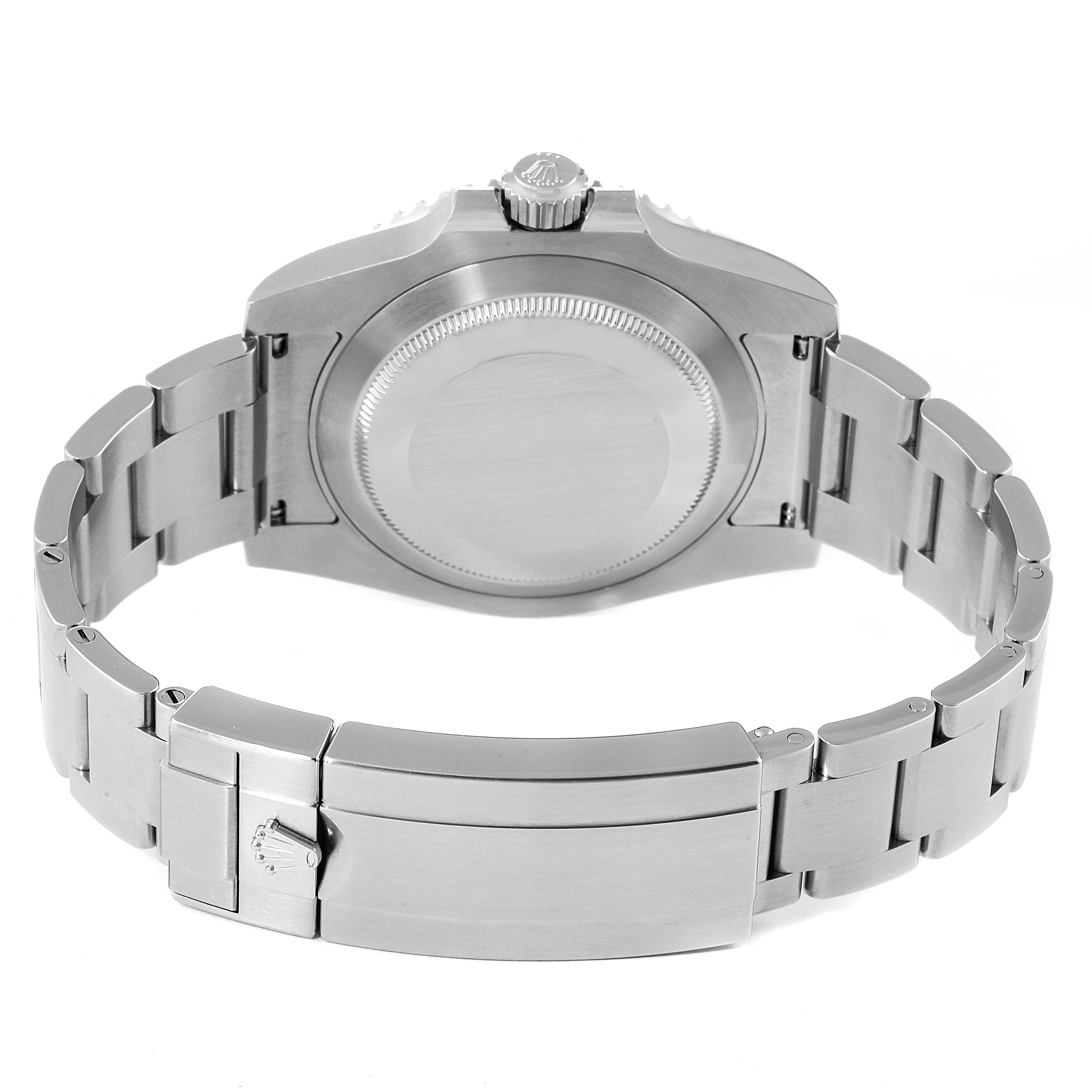 The image shows the back view of a Rolex Submariner 114060 Men
s Stainless Steel Black Dial 114060 Men
s Stainless Steel Black Dial, highlighting its case back and metal bracelet with clasp.