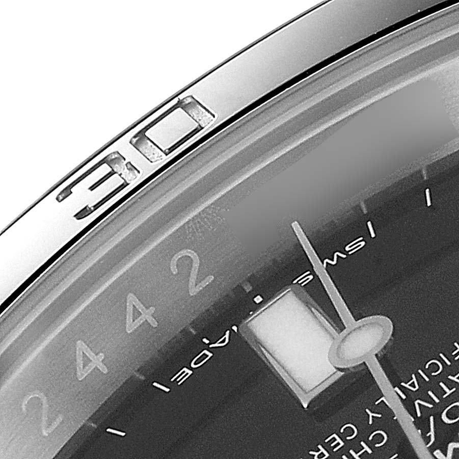 The image shows a close-up, partial view of the bezel and dial of the Rolex Submariner 114060 Men
s Stainless Steel Black Dial 114060 Men
s Stainless Steel Black Dial watch.