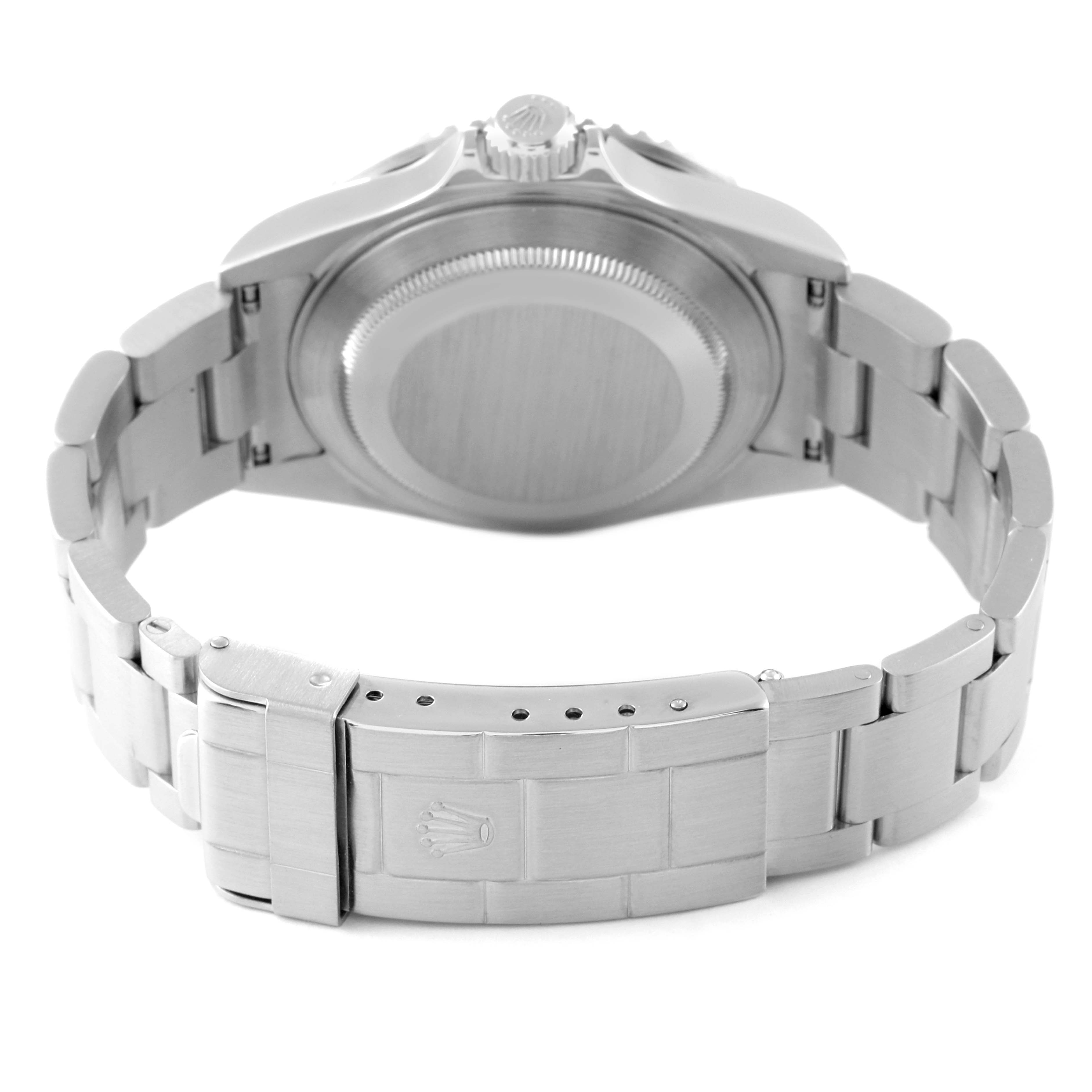 The image shows the back view of a Rolex Submariner 16610 Men
s Stainless Steel Black Dial 16610 Men
s Stainless Steel Black Dial watch, highlighting its stainless steel case back and bracelet clasp.