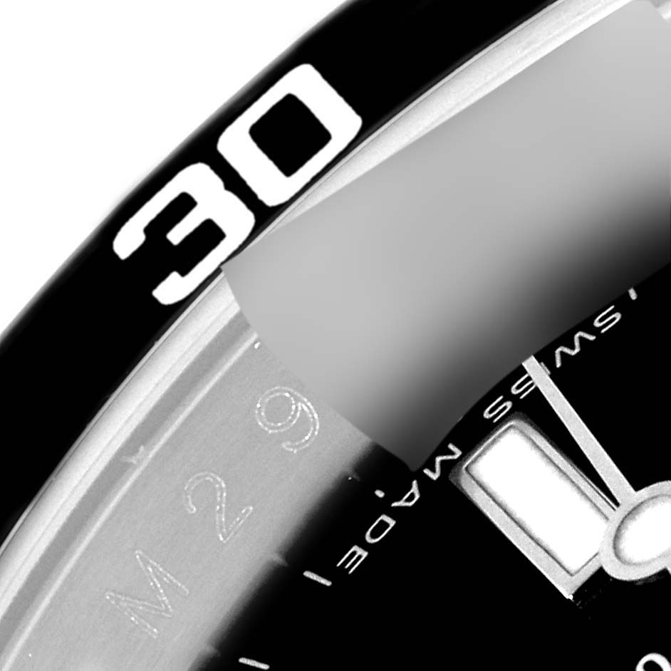 This image shows a close-up of the dial and bezel of a Rolex Submariner 16610 Men
s Stainless Steel Black Dial 16610 Men
s Stainless Steel Black Dial watch, focusing on the numeral "30" and part of the minute markers.