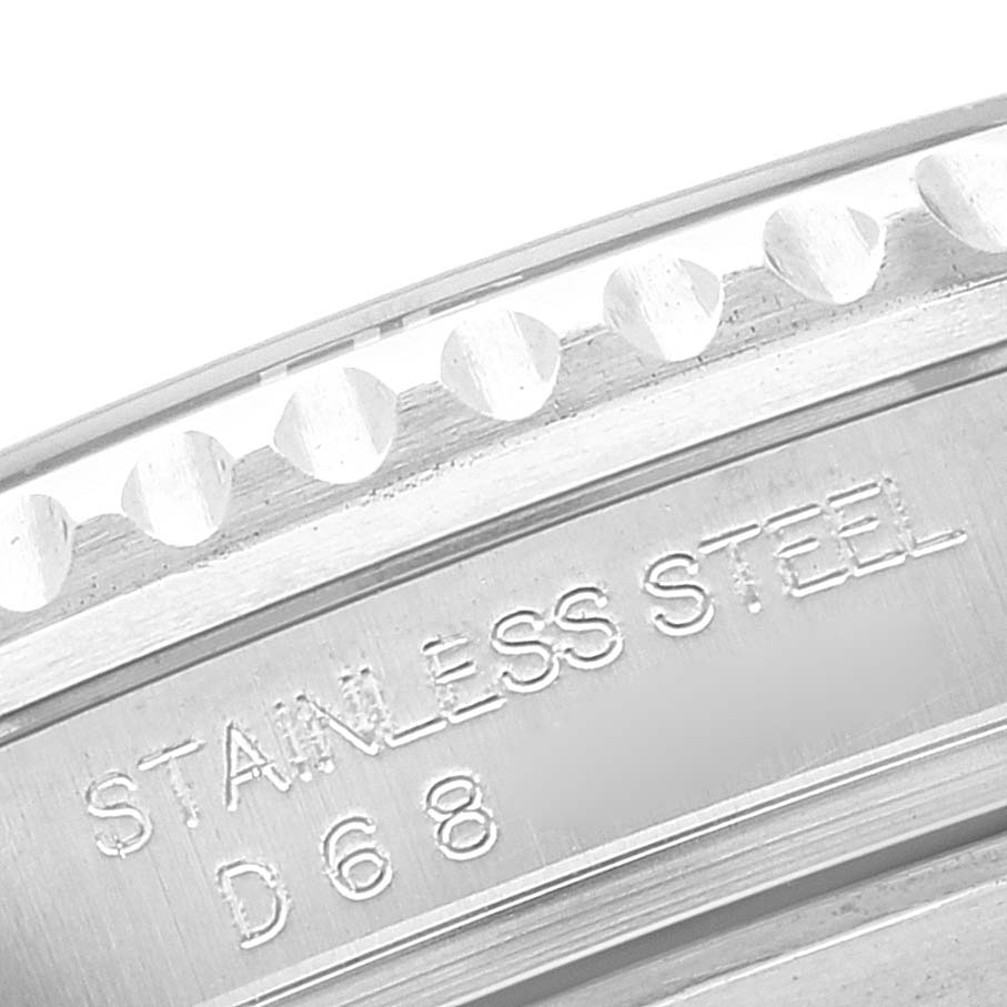 This close-up image shows a stainless steel case side with engravings on a Rolex Submariner 16610 Men
s Stainless Steel Black Dial 16610 Men
s Stainless Steel Black Dial watch.