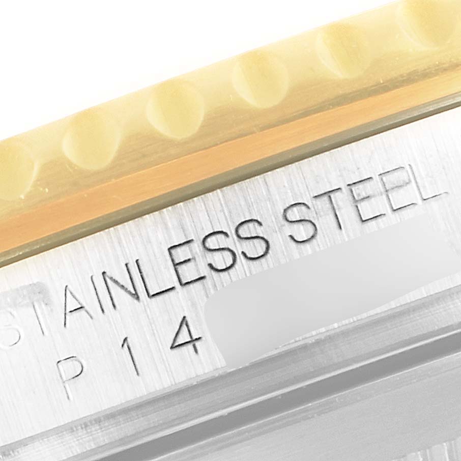 This close-up shows the bezel and case side of a Rolex Submariner 16613 Men
s Steel and Gold (two tone) Blue Dial 16613 Men
s Steel and Gold (two tone) Blue Dial, with "STAINLESS STEEL" engraved.