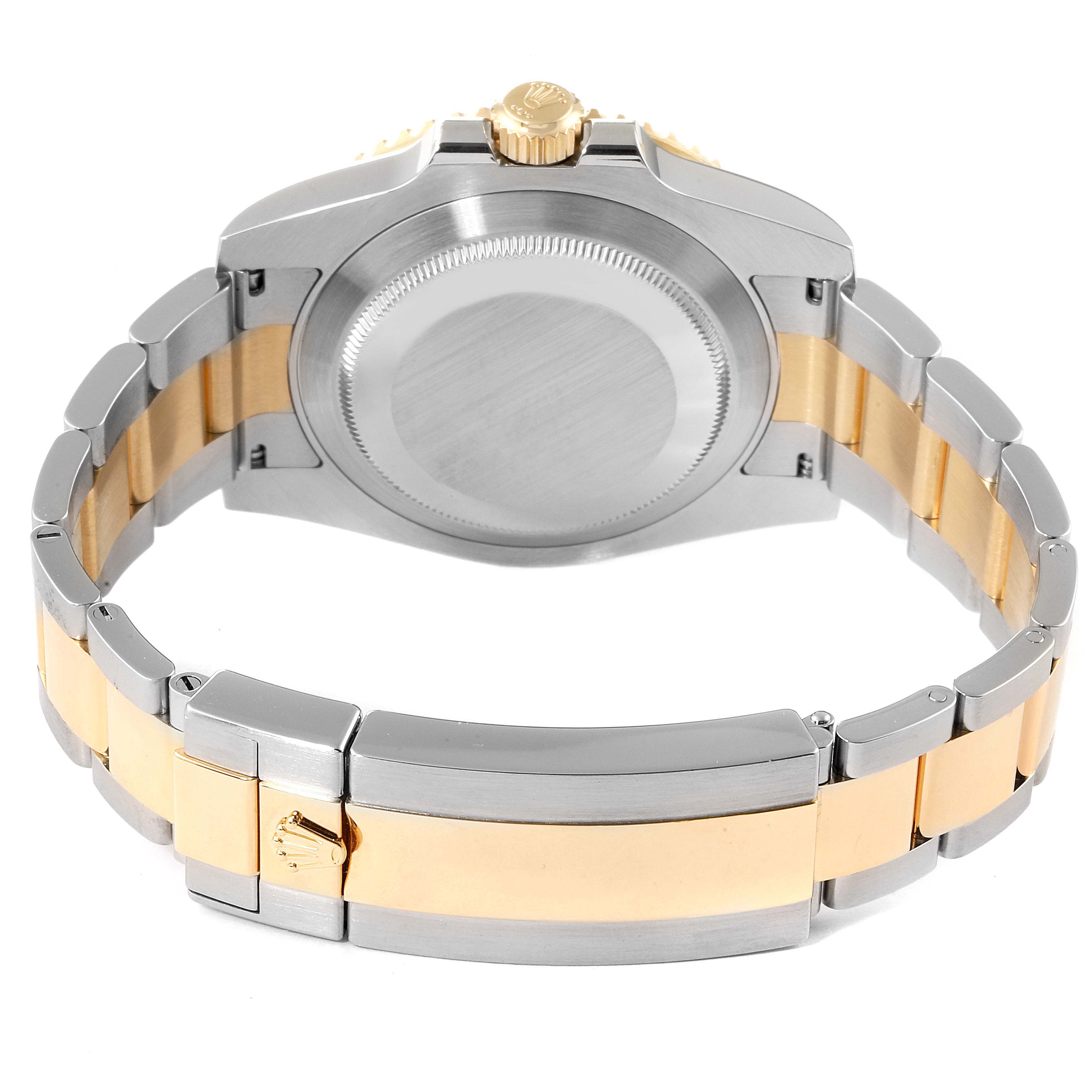 The image shows the back case and bracelet of a Rolex Submariner 116613 Men's Steel and Gold (two tone) Blue Dial 116613 Men's Steel and Gold (two tone) Blue Dial watch, featuring a two-tone silver and gold design.