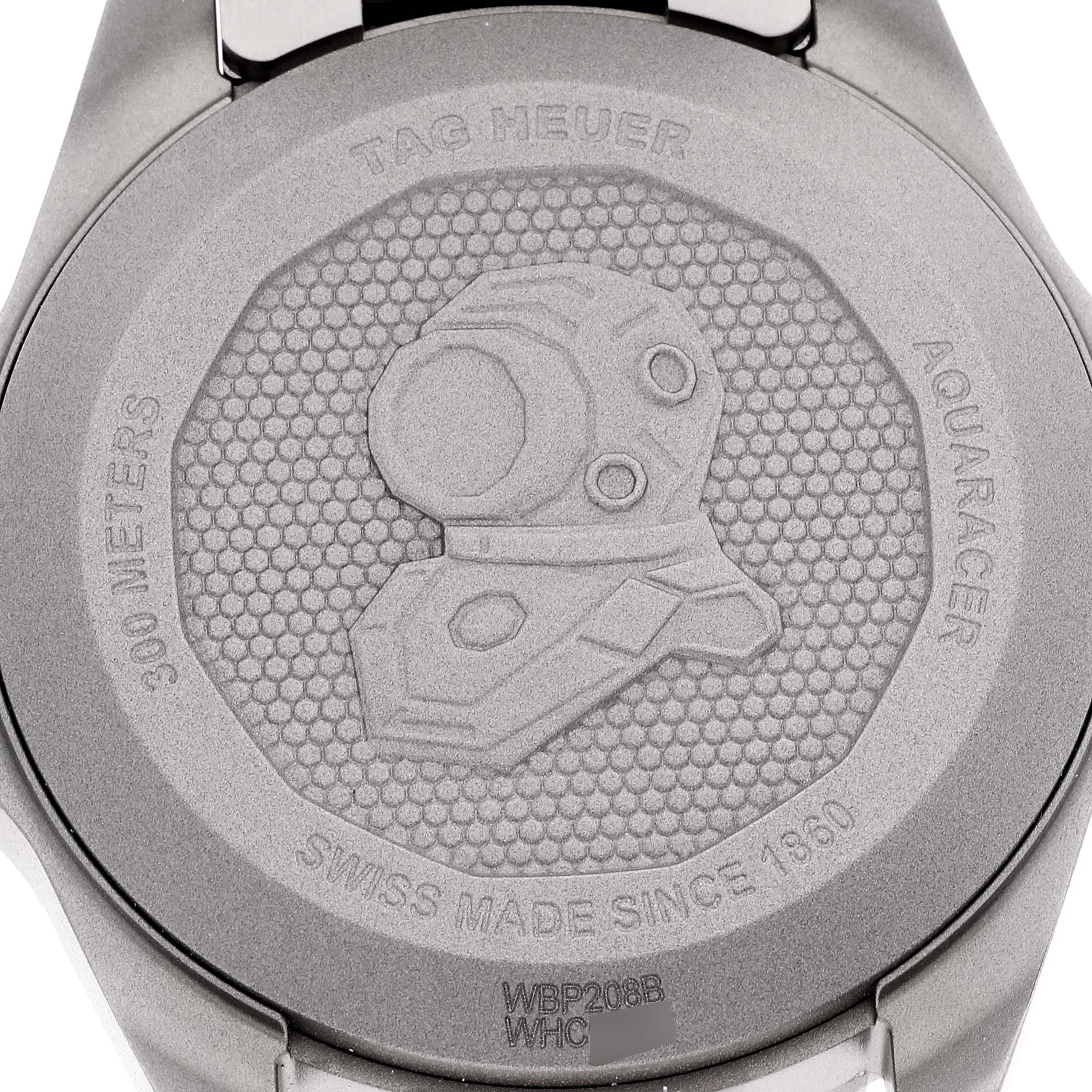 This image shows the engraved case back of a Tag Heuer Aquaracer WBP208B.BF0631 Men's Titanium Green Dial WBP208B.BF0631 Men's Titanium Green Dial watch with a diving helmet and text details.
