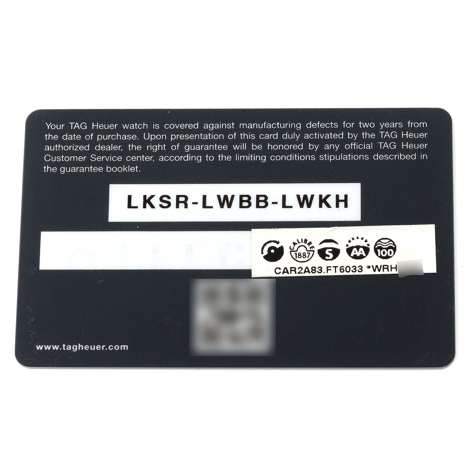 The image shows a warranty card for the Tag Heuer Carrera CAR2A83.FT6033 Men's Titanium Black Dial CAR2A83.FT6033 Men's Titanium Black Dial model watch, showing the serial number and manufacturing information.