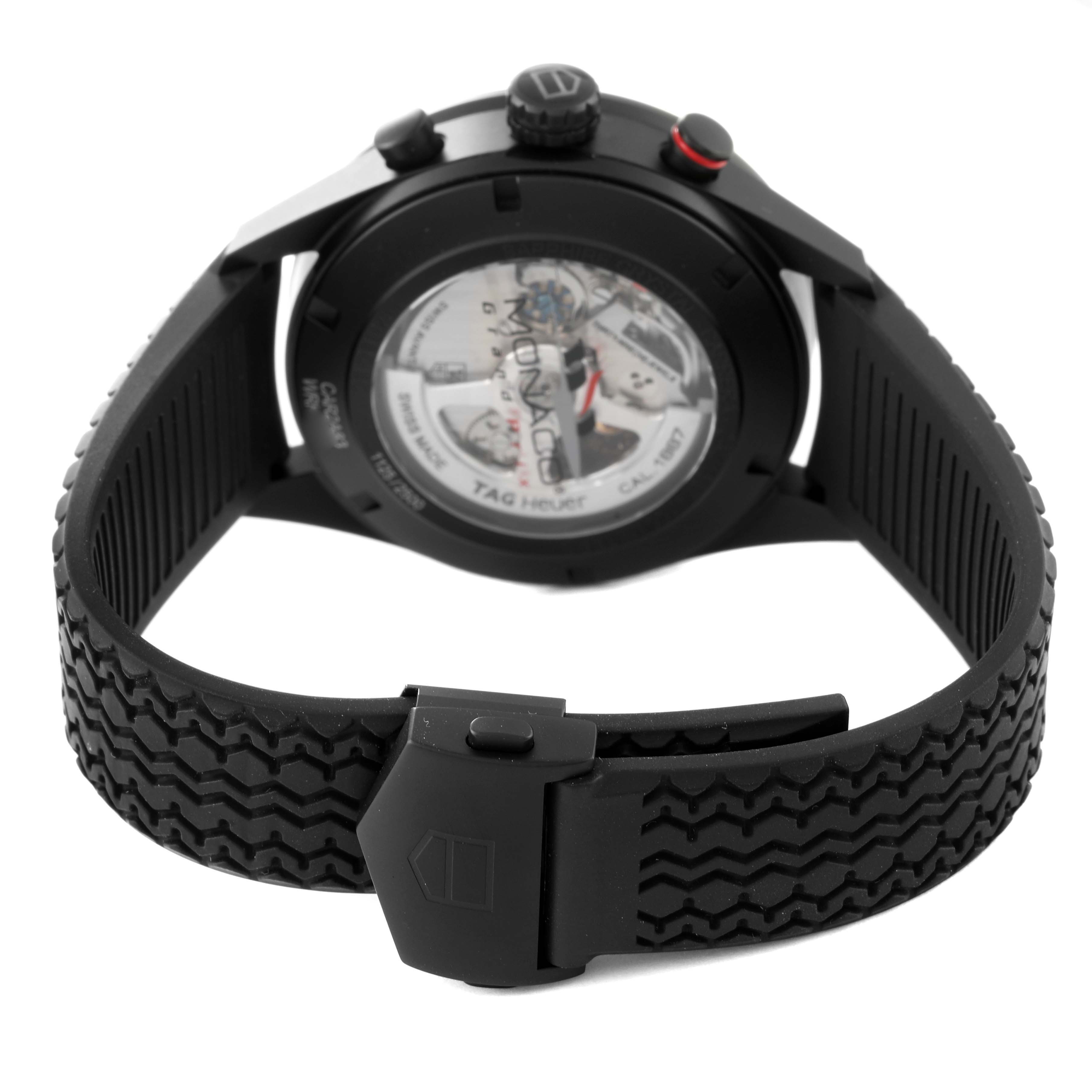 The image shows the back and strap of a Tag Heuer Carrera CAR2A83.FT6033 Men's Titanium Black Dial CAR2A83.FT6033 Men's Titanium Black Dial watch, highlighting the detailed clasp and exposed movement.