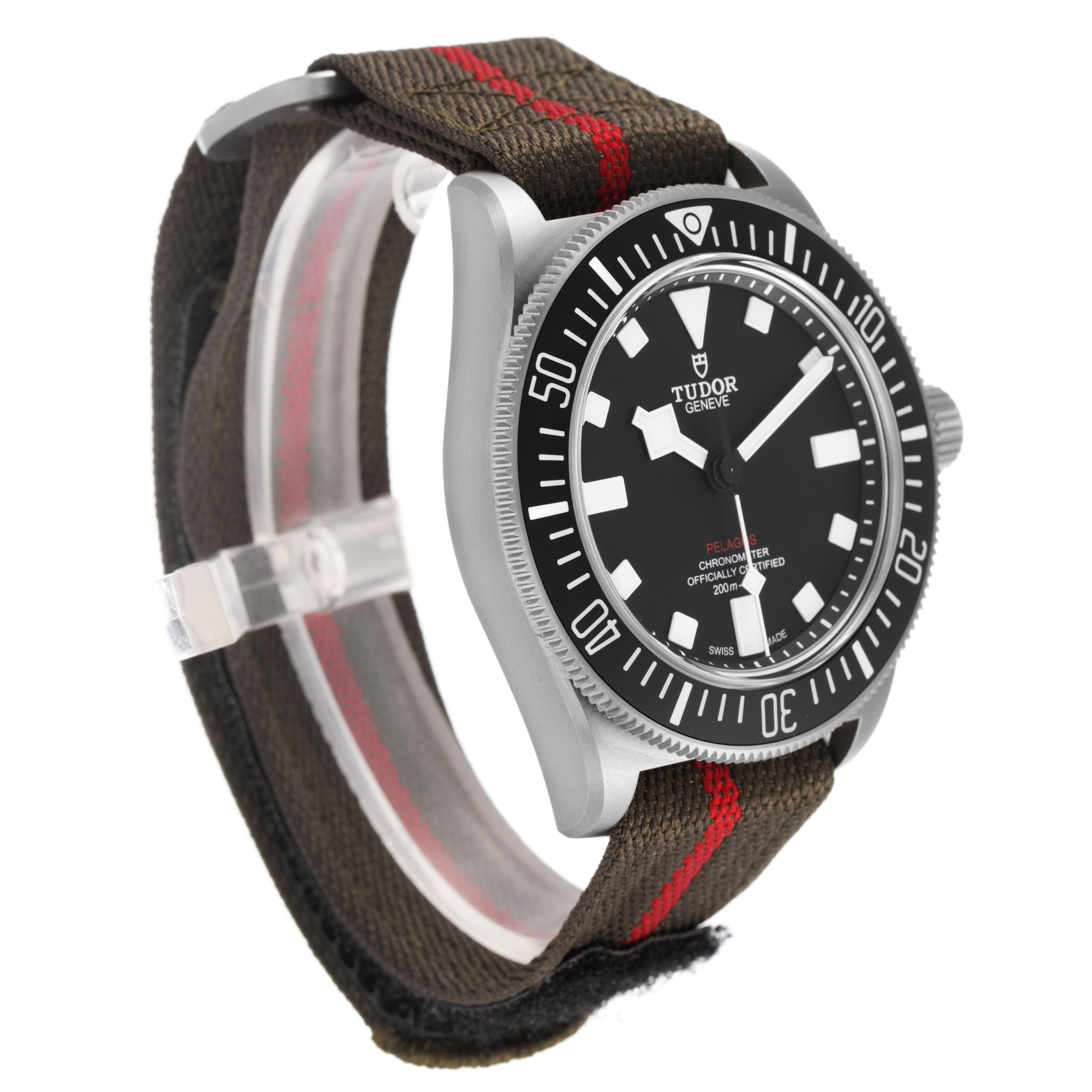 The Tudor Pelagos 25717 Men's Titanium Black Dial watch is shown at a three-quarter angle, highlighting the dial, bezel, case, and fabric strap.