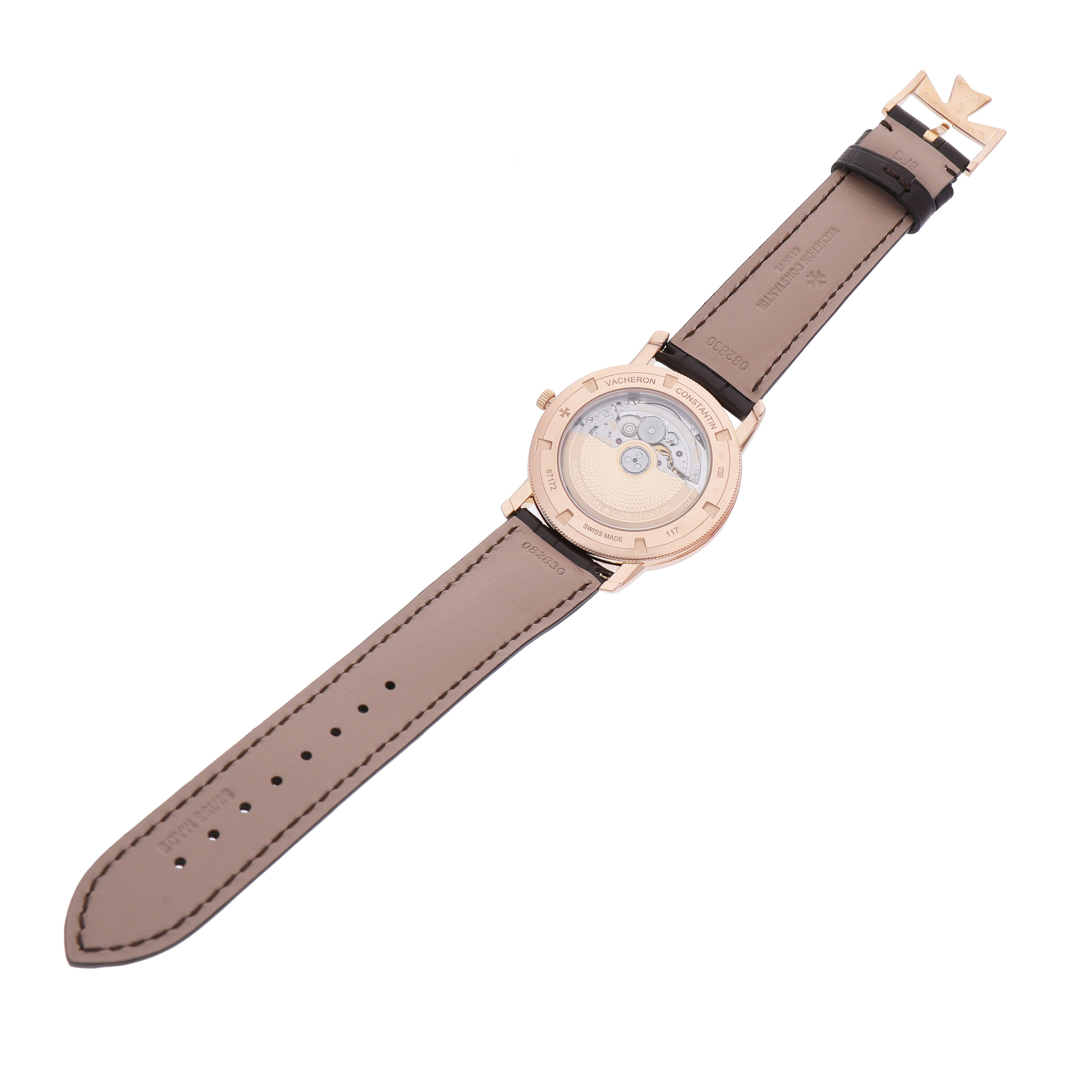 The image shows the back view of the Traditionnelle model by Vacheron Constantin, highlighting the movement and leather strap.