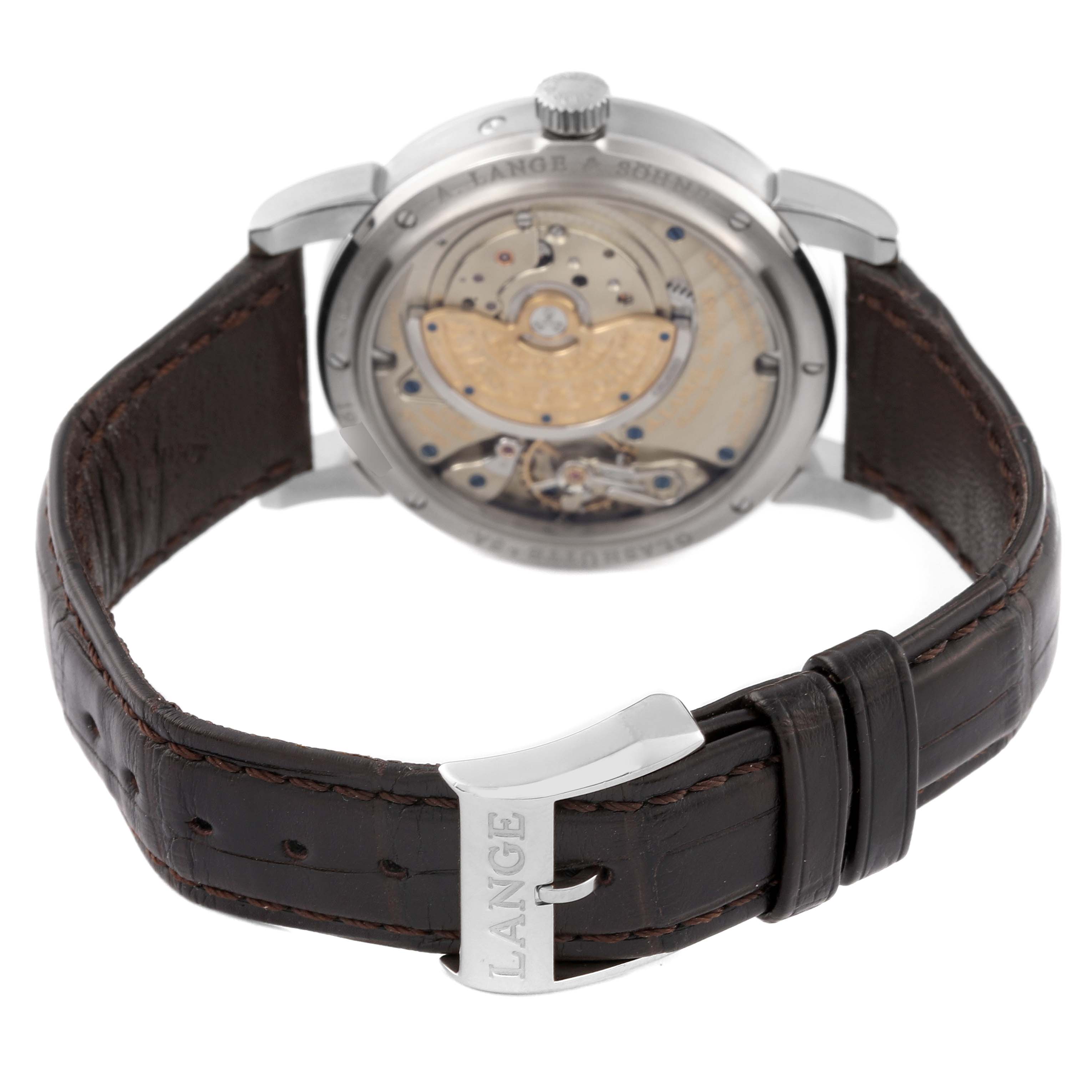 The image shows the Saxonia model by A. Lange & Söhne from the back, displaying the movement and leather strap.