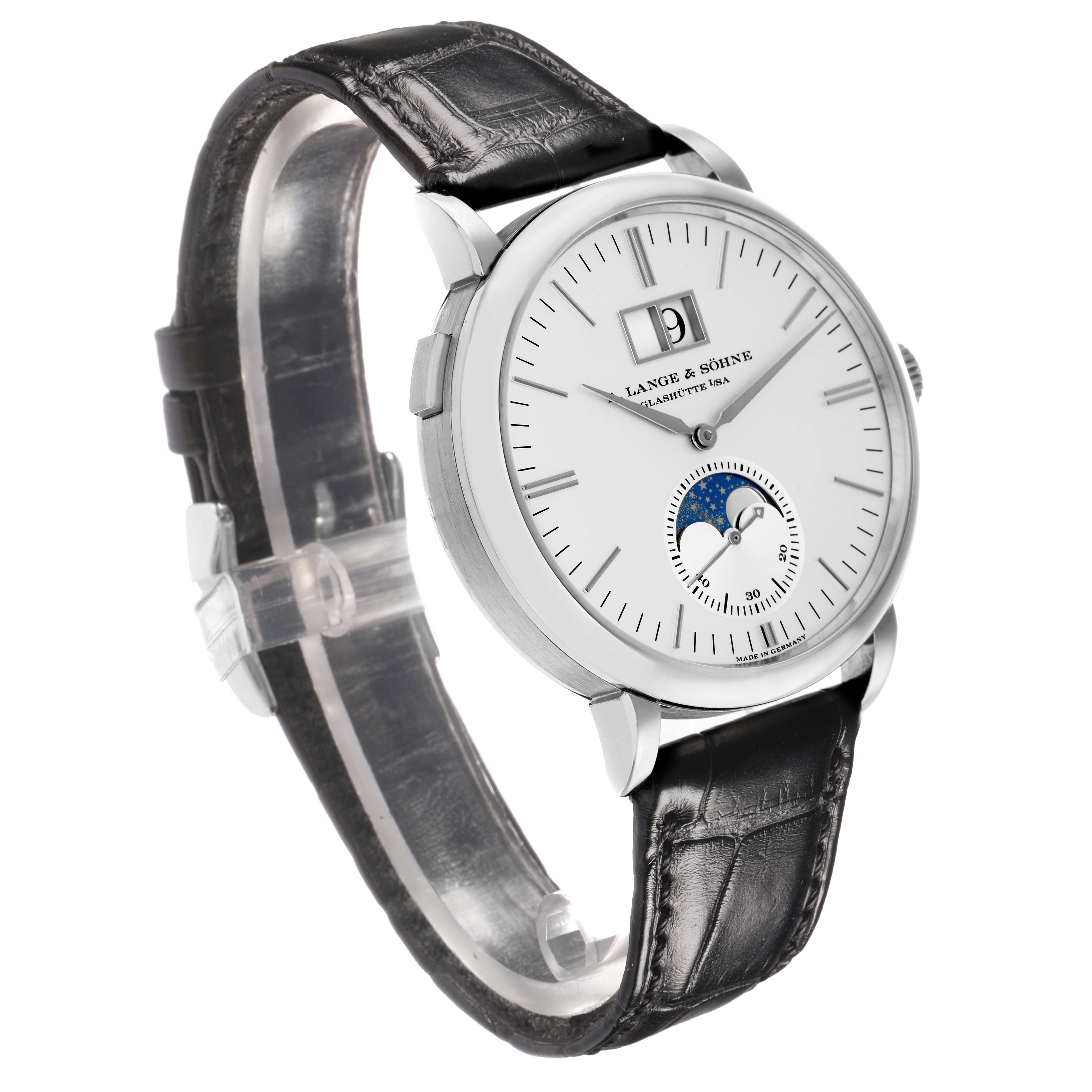 The A. Lange 
Sohne Saxonia 384.026 Men
s White Gold Silver Dial watch is shown at a three-quarter angle, displaying the dial, moon phase, case, and leather strap.