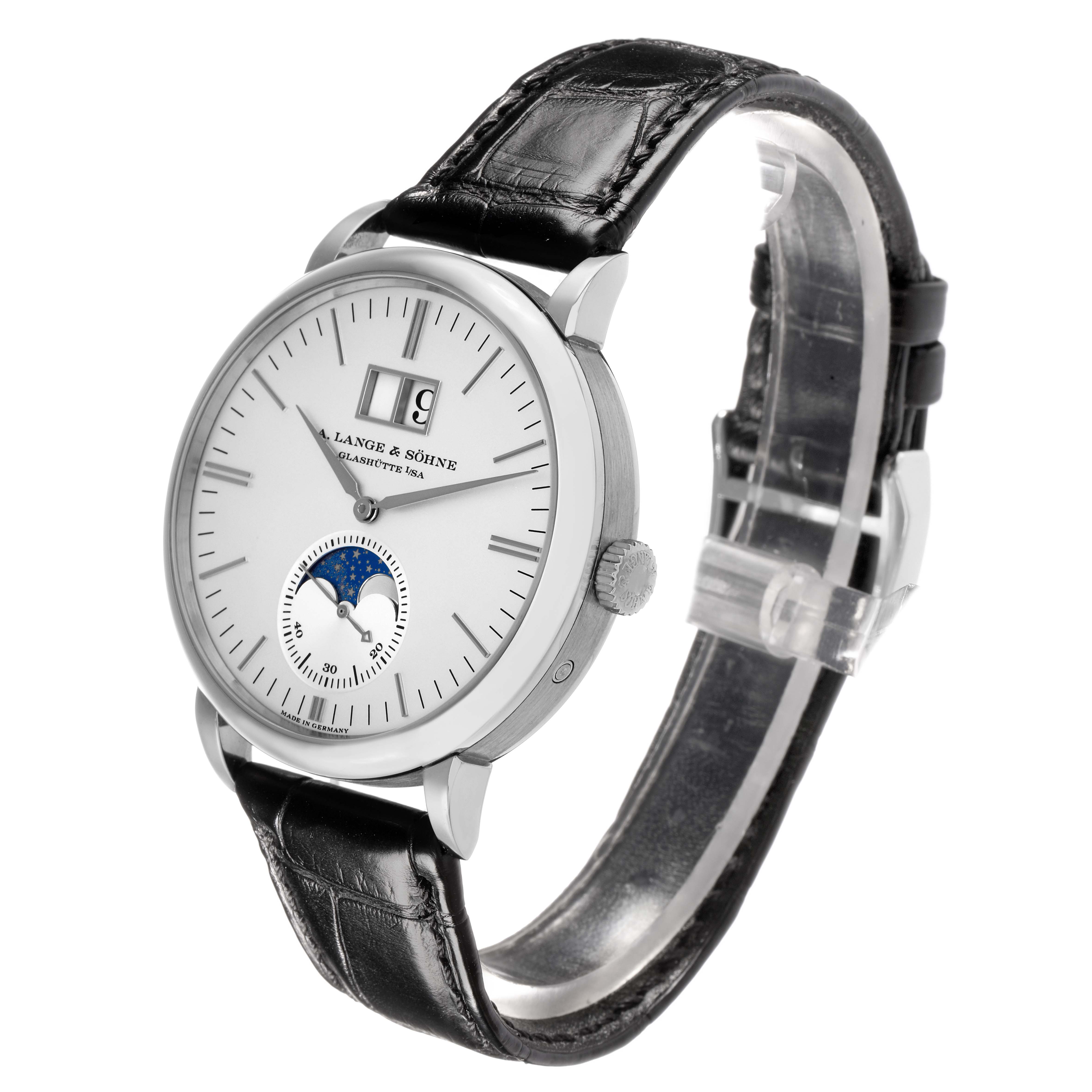 The A. Lange 
Sohne Saxonia 384.026 Men
s White Gold Silver Dial watch is shown at a three-quarter angle, displaying the dial, moon phase, large date, and leather strap.