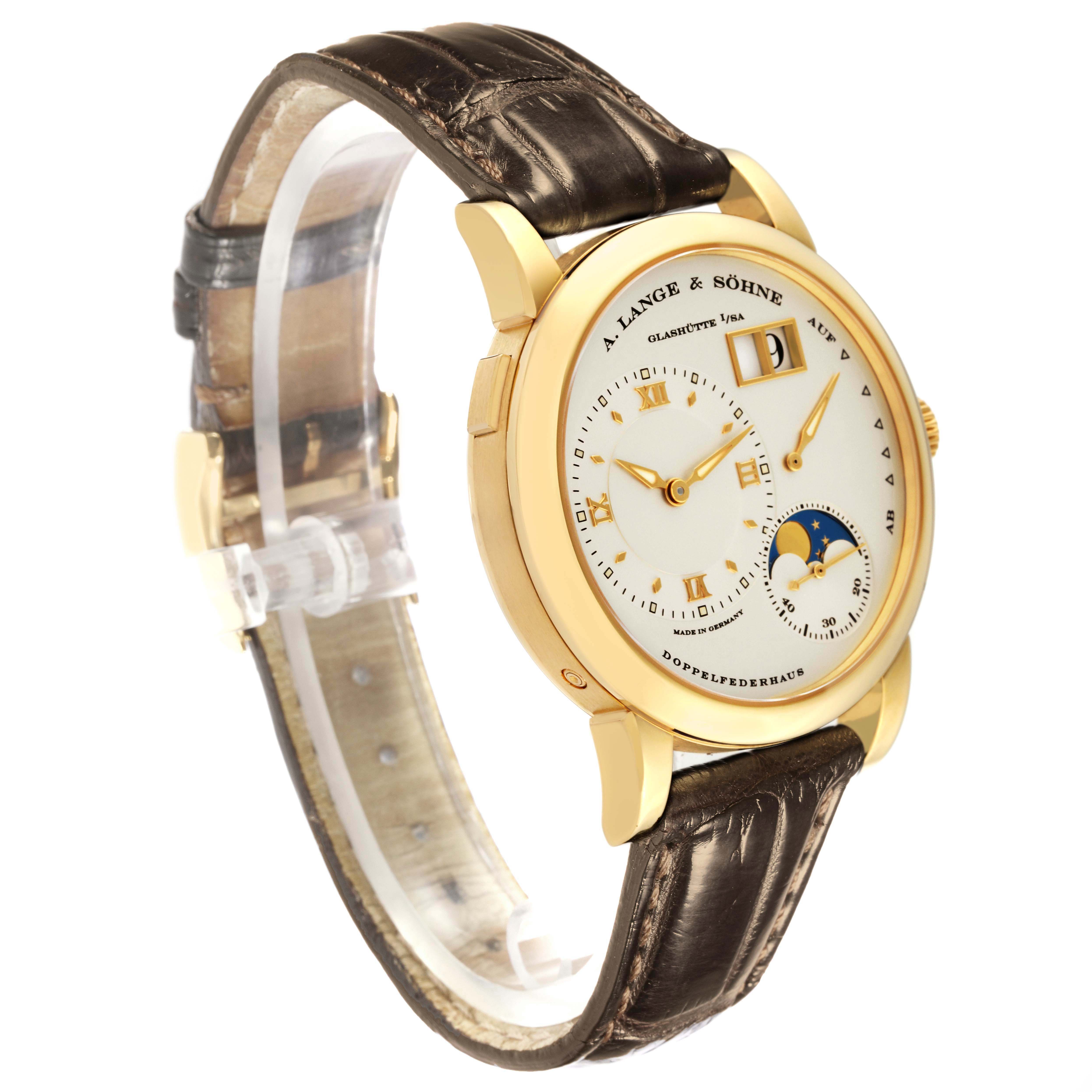 The Lange 1 by A. Lange 
Söhne is shown at a three-quarter angle, displaying the dial, case, and leather strap.