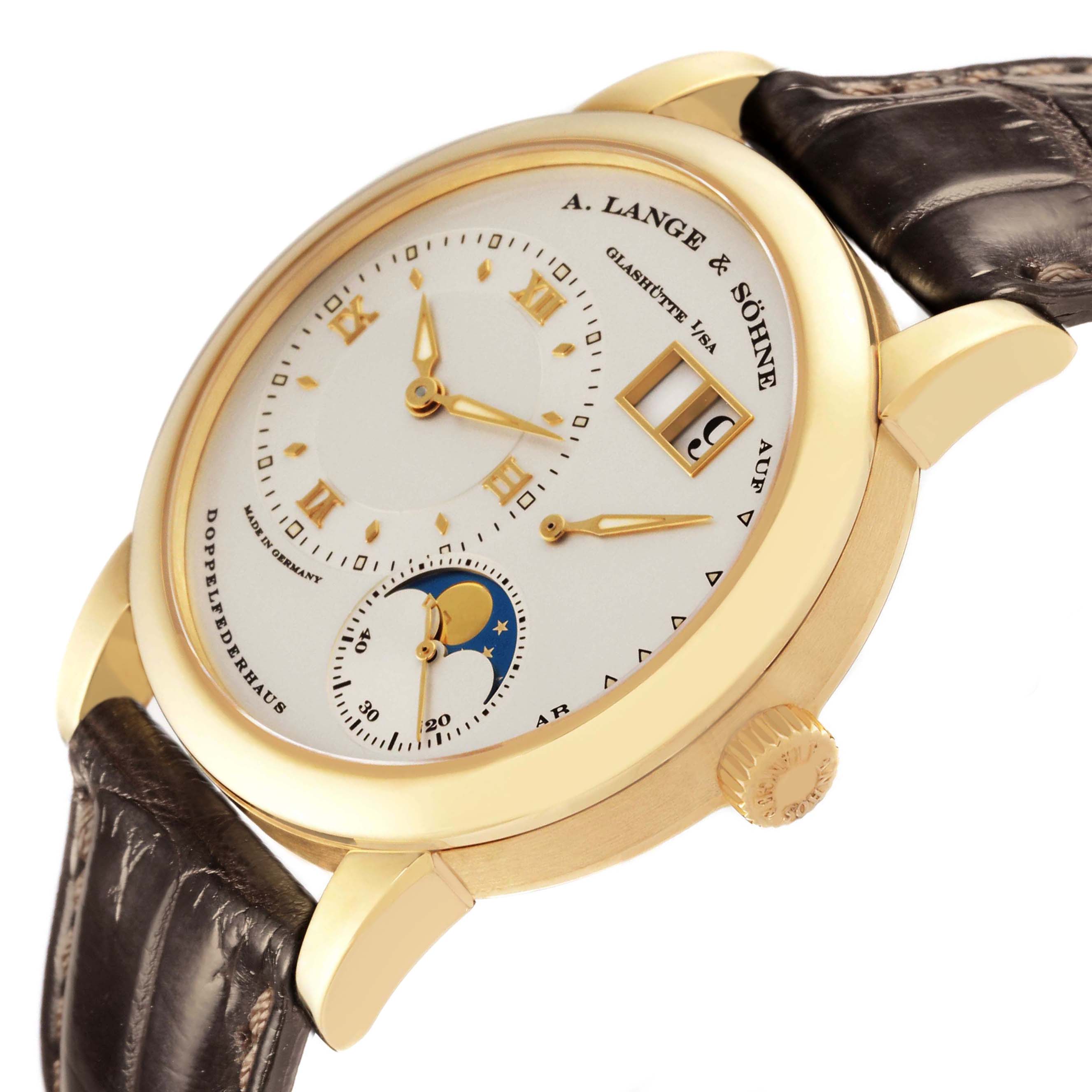 The A. Lange 
Sohne Lange 1 109.021 Men
s Yellow Gold Silver Dial watch is shown from an angled close-up, highlighting the dial, moon phase, and crown.