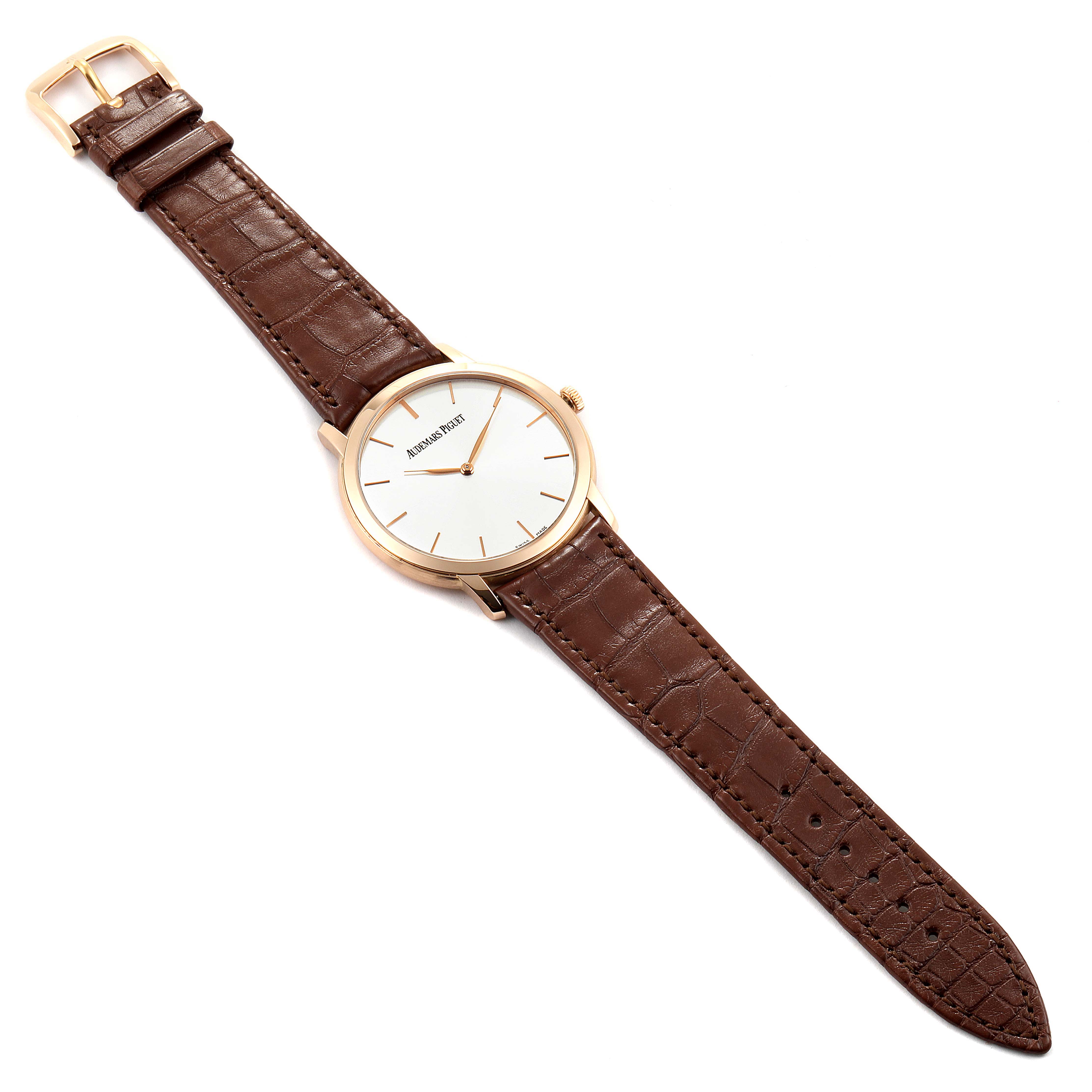 The image shows an angled top view of the Jules model by Audemars Piguet, featuring its face, crown, and full leather strap.