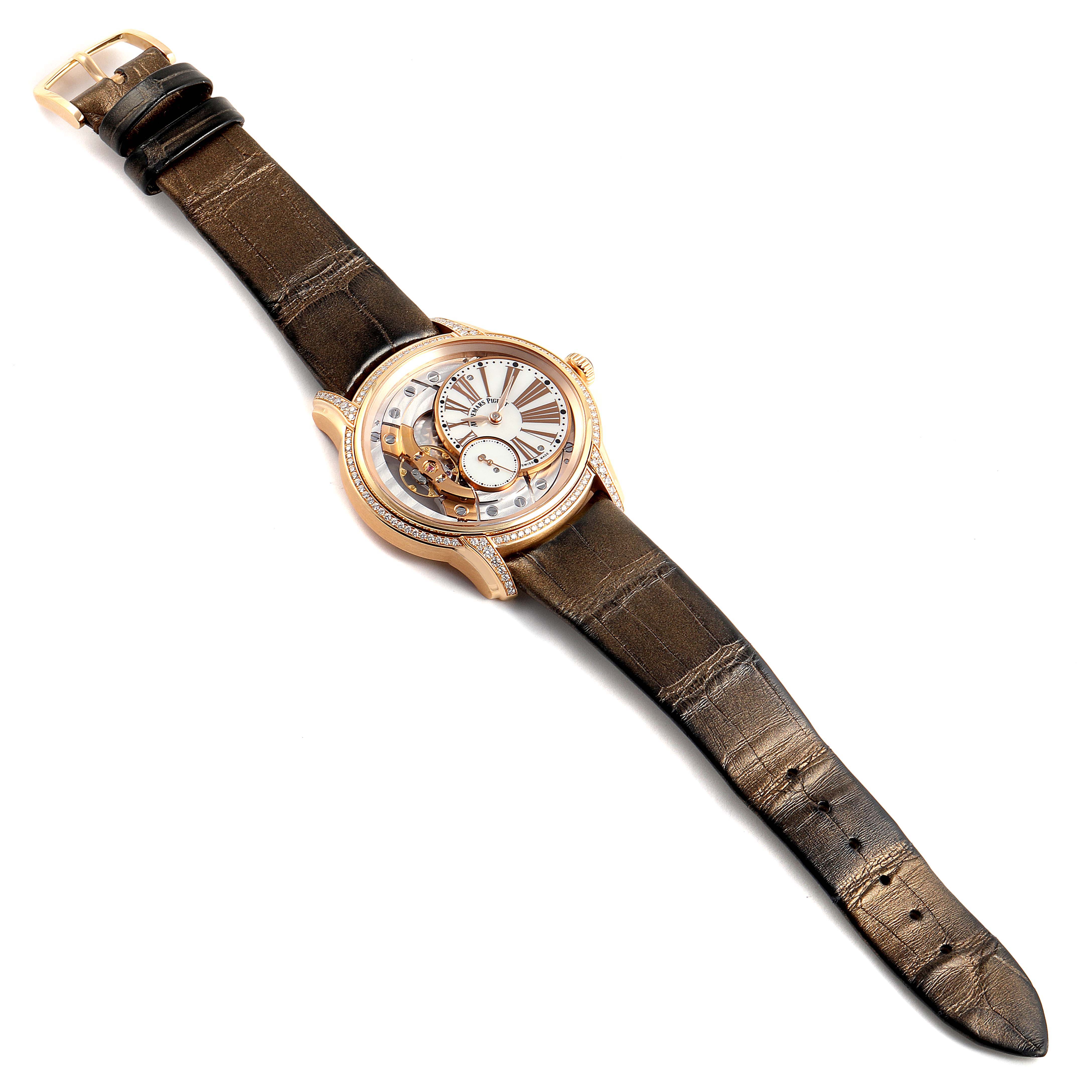 The image shows a top-down view of an Audemars Piguet Millenary 77247OR.ZZ.1272OR.01 Women's Rose Gold Mother of Pearl Dial 77247OR.ZZ.1272OR.01 Women's Rose Gold Mother of Pearl Dial model watch, highlighting its case, dial, and leather strap.