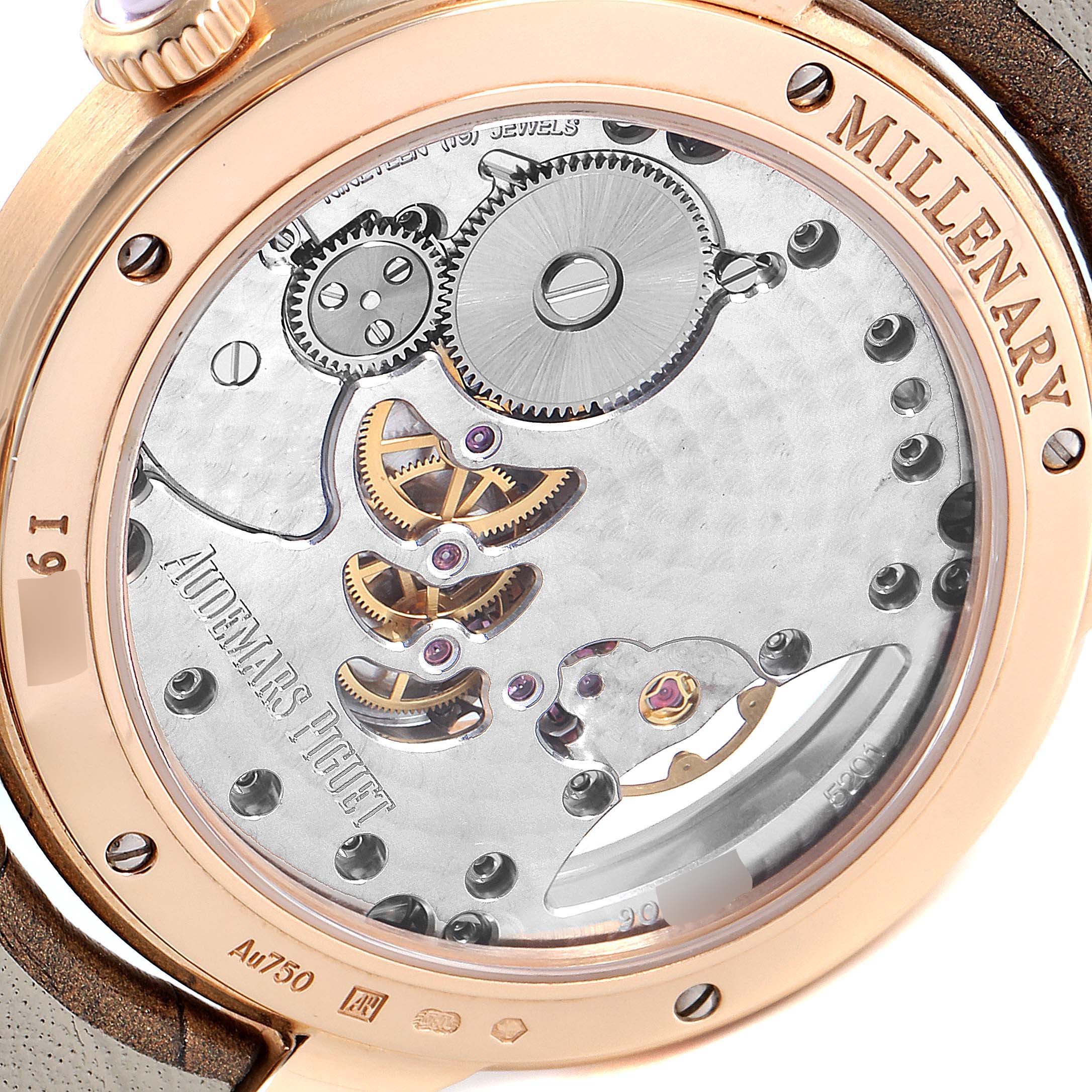 The image shows a close-up of the Audemars Piguet Millenary 77247OR.ZZ.1272OR.01 Women's Rose Gold Mother of Pearl Dial 77247OR.ZZ.1272OR.01 Women's Rose Gold Mother of Pearl Dial model watch's transparent case back, revealing its intricate movement.