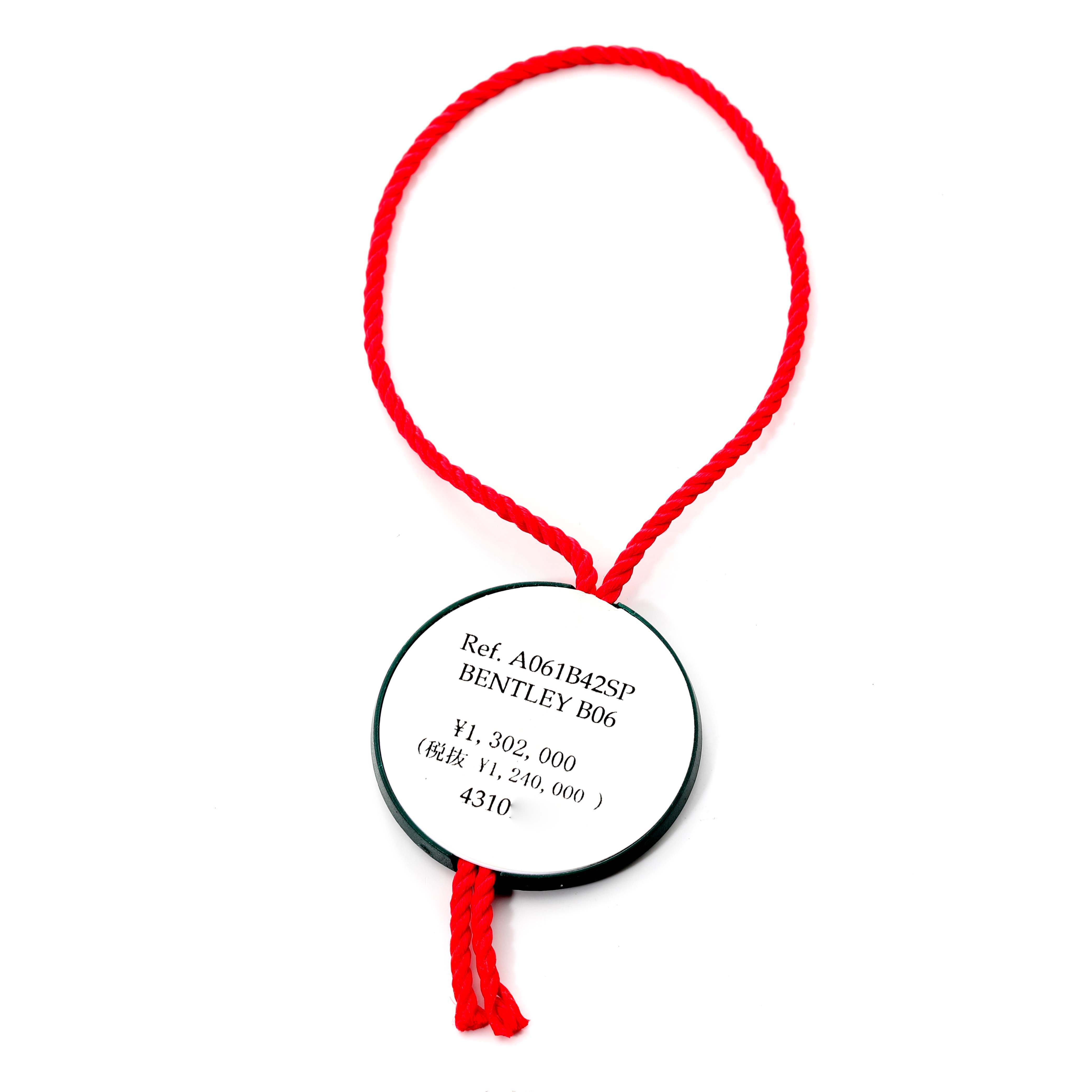 The image shows a price tag on a red string for the Breitling Bentley AB061112.BD80.990A Men's Stainless Steel Black Dial AB061112.BD80.990A Men's Stainless Steel Black Dial B06 model.