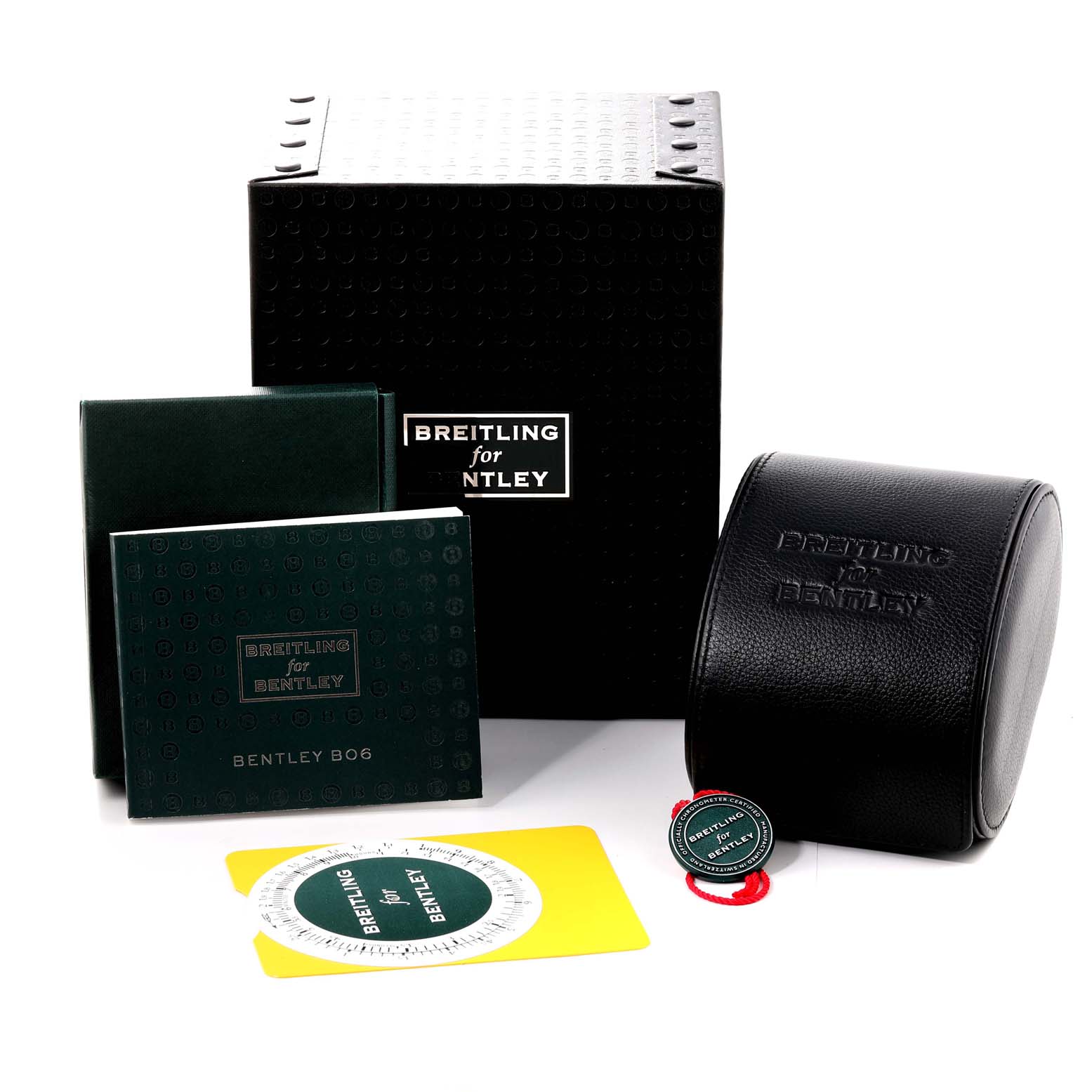 This image shows various accessories for the Breitling Bentley AB061112.BD80.990A Men's Stainless Steel Black Dial AB061112.BD80.990A Men's Stainless Steel Black Dial model, including boxes, booklets, and a carrying case.
