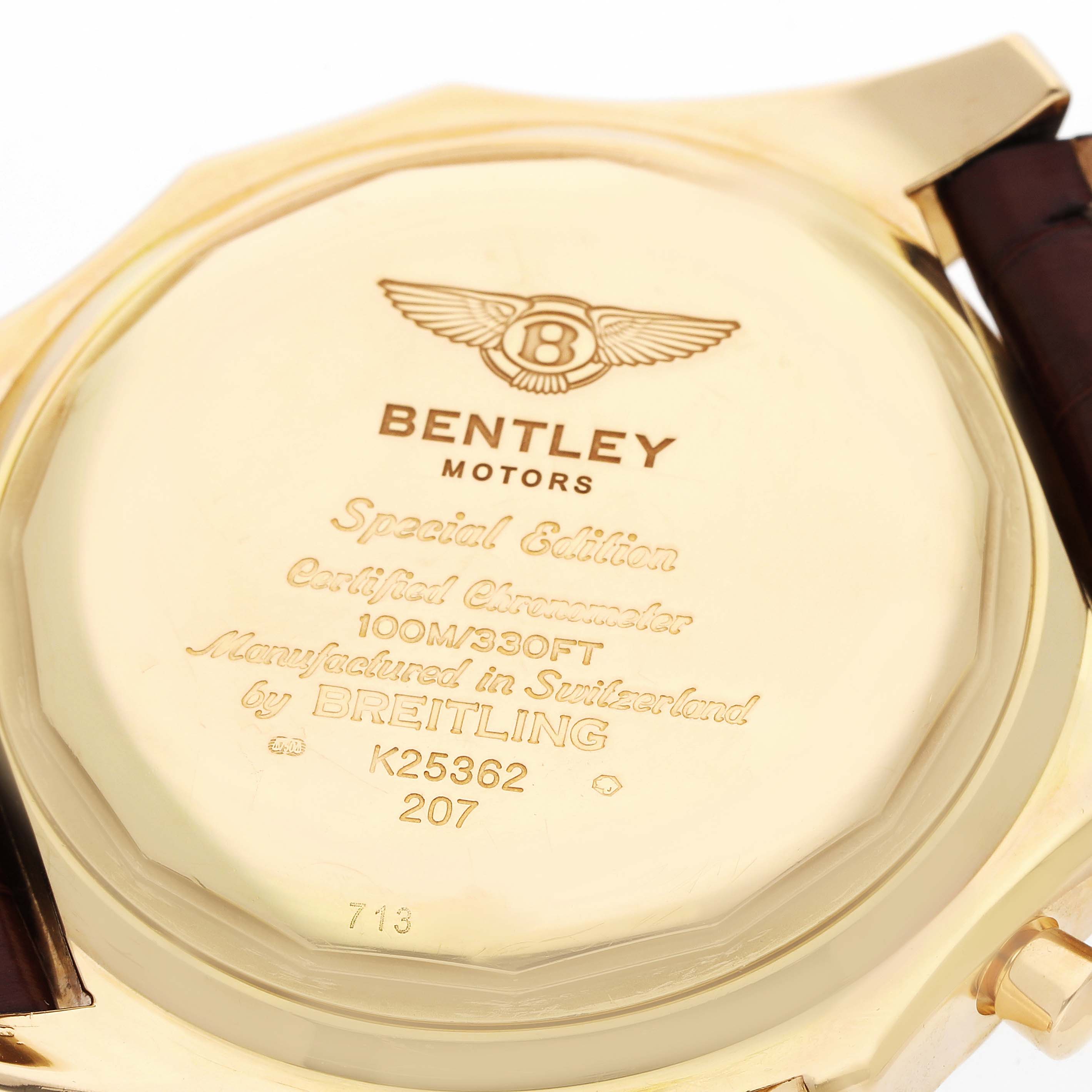 The image shows the back casing of a Breitling Bentley K25362 Men
s Yellow Gold Black Dial watch, featuring engraved branding and model information.