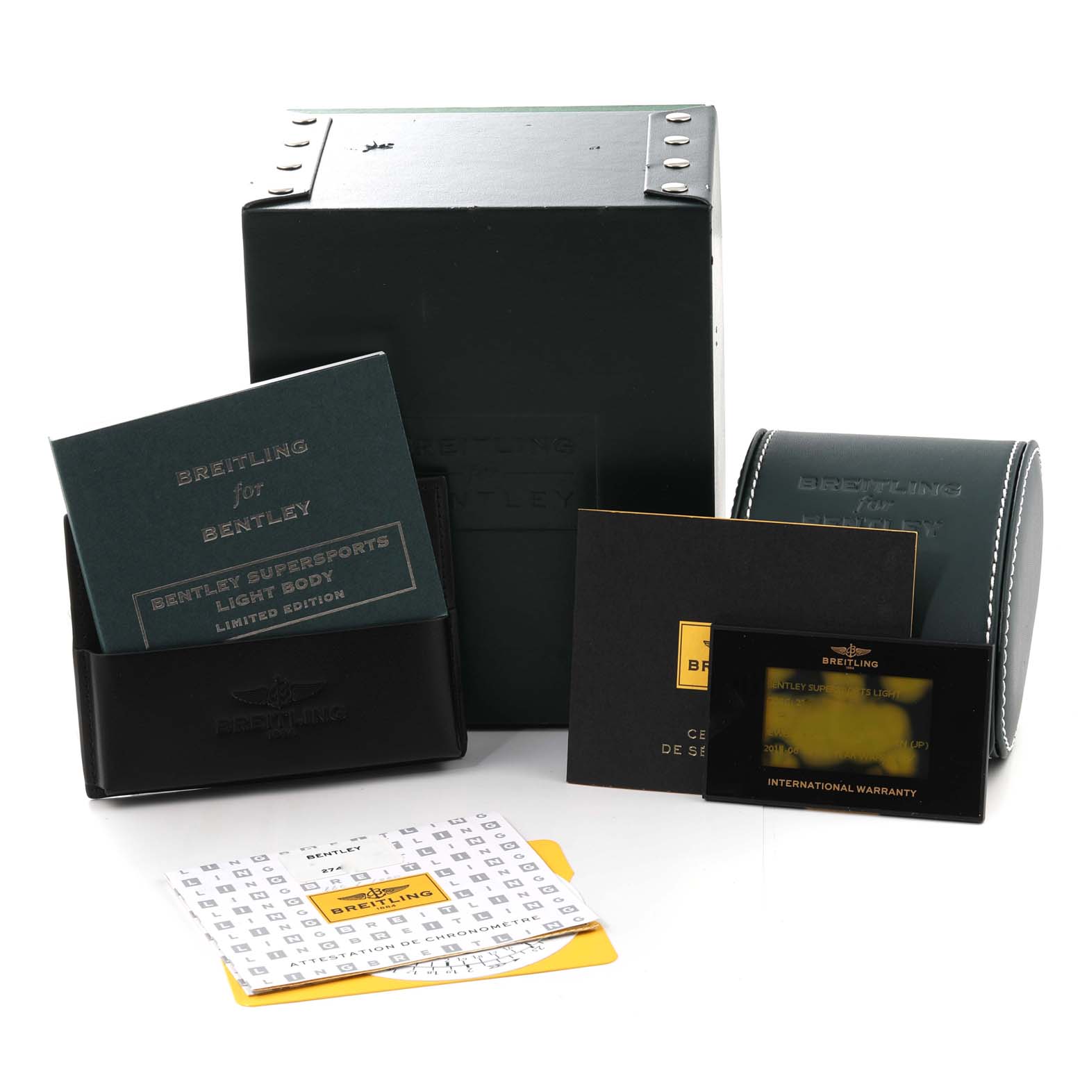 The image shows the packaging and accessories for the Bentley model by Breitling, including booklets, a case, and warranty card.