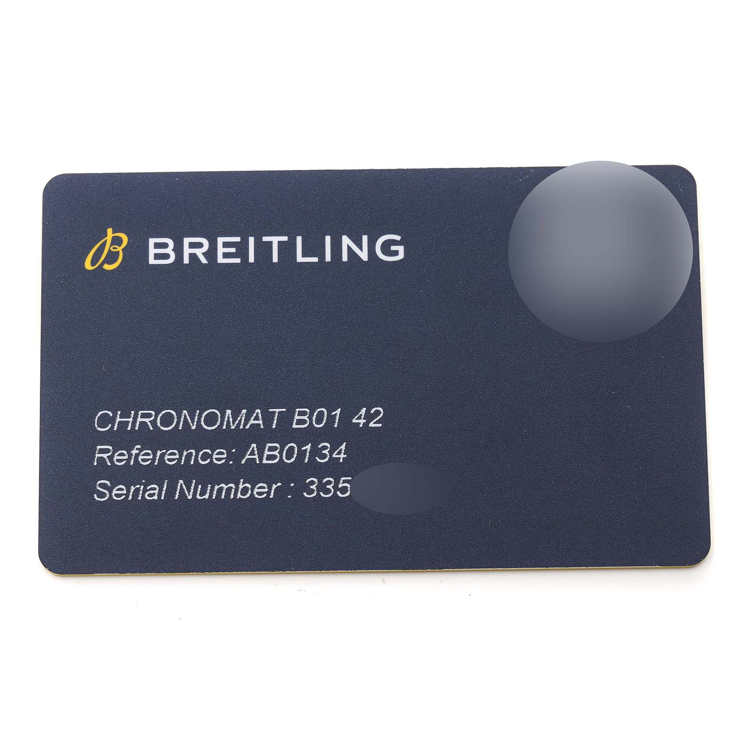 This image shows a Breitling Chronomat AB0134 Men
s Stainless Steel Silver Dial AB0134 Men
s Stainless Steel Silver Dial B01 42 warranty card, displaying reference and serial numbers.