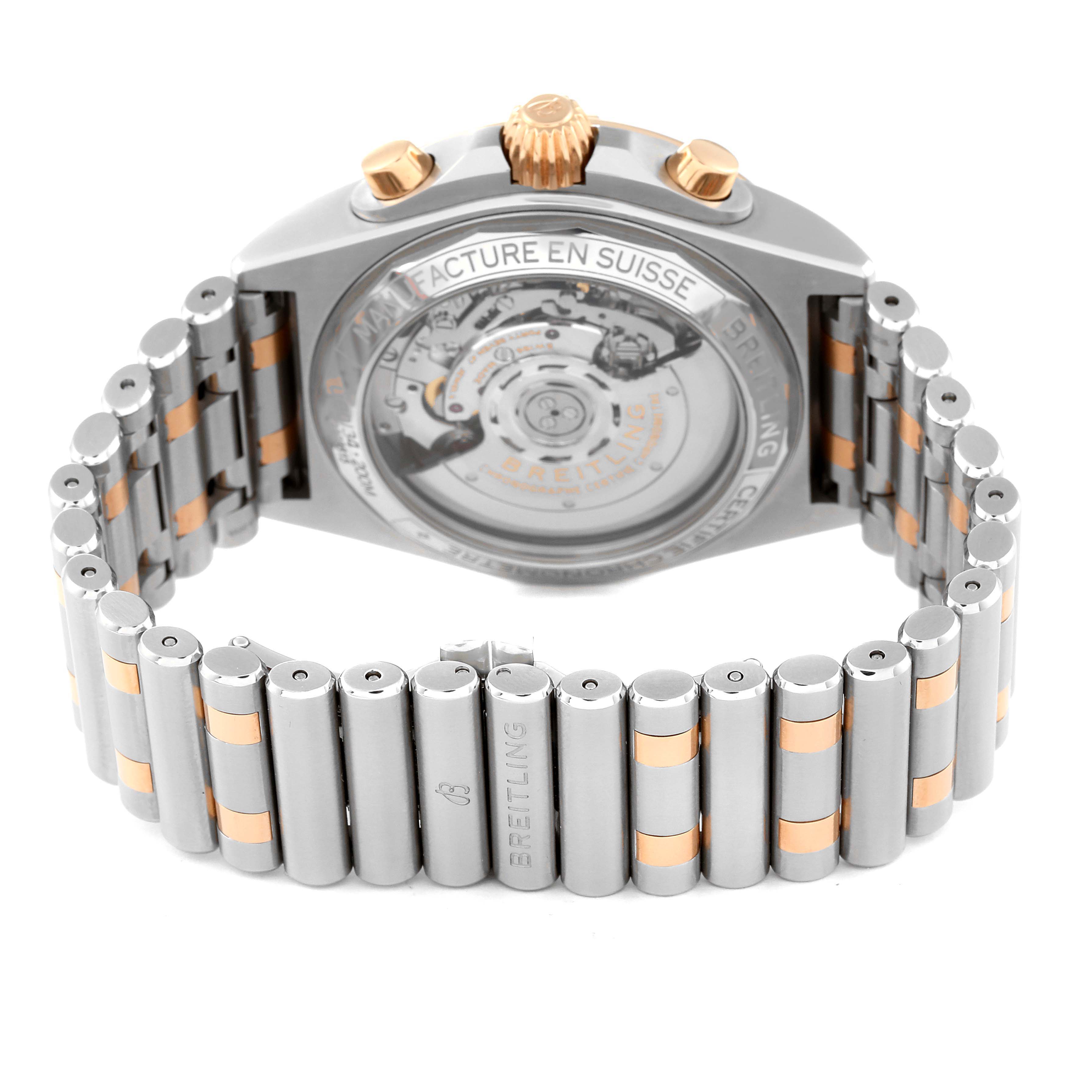 This image shows the back and bracelet of a Breitling Chronomat UB0134 Men's Steel and Gold (two tone) Grey Dial UB0134 Men's Steel and Gold (two tone) Grey Dial watch, highlighting its movement and two-tone metal links.