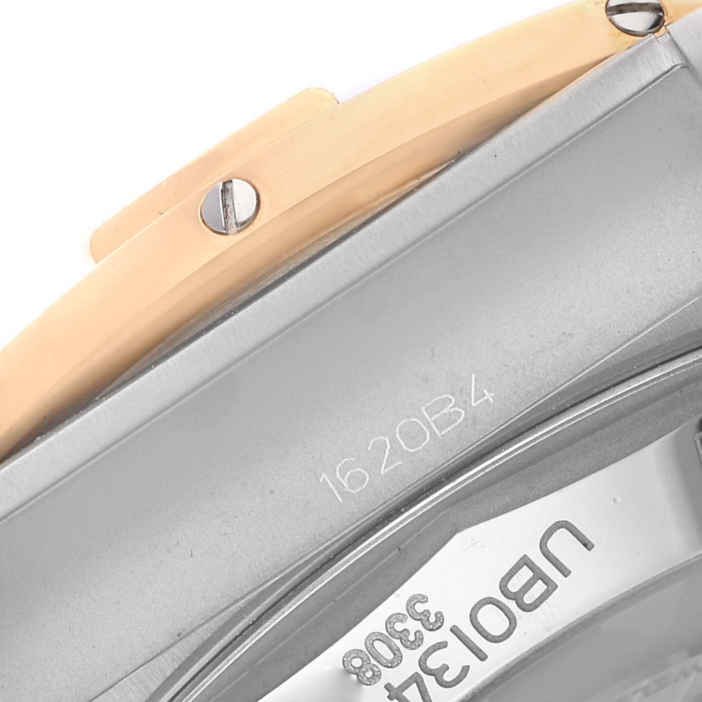 This image shows a close-up of the side and back of a Breitling Chronomat UB0134 Men's Steel and Gold (two tone) Grey Dial UB0134 Men's Steel and Gold (two tone) Grey Dial watch, highlighting the case and bezel screws.