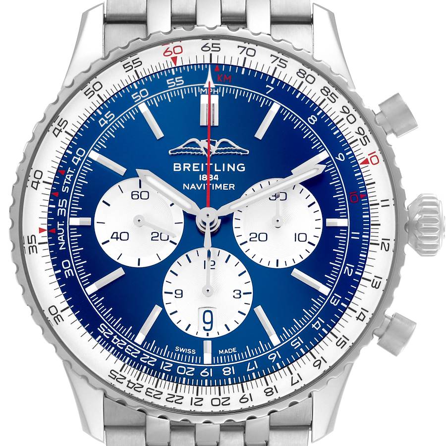 The Breitling Navitimer watch is shown from a front angle, featuring its blue dial, chronograph subdials, and stainless steel bracelet.