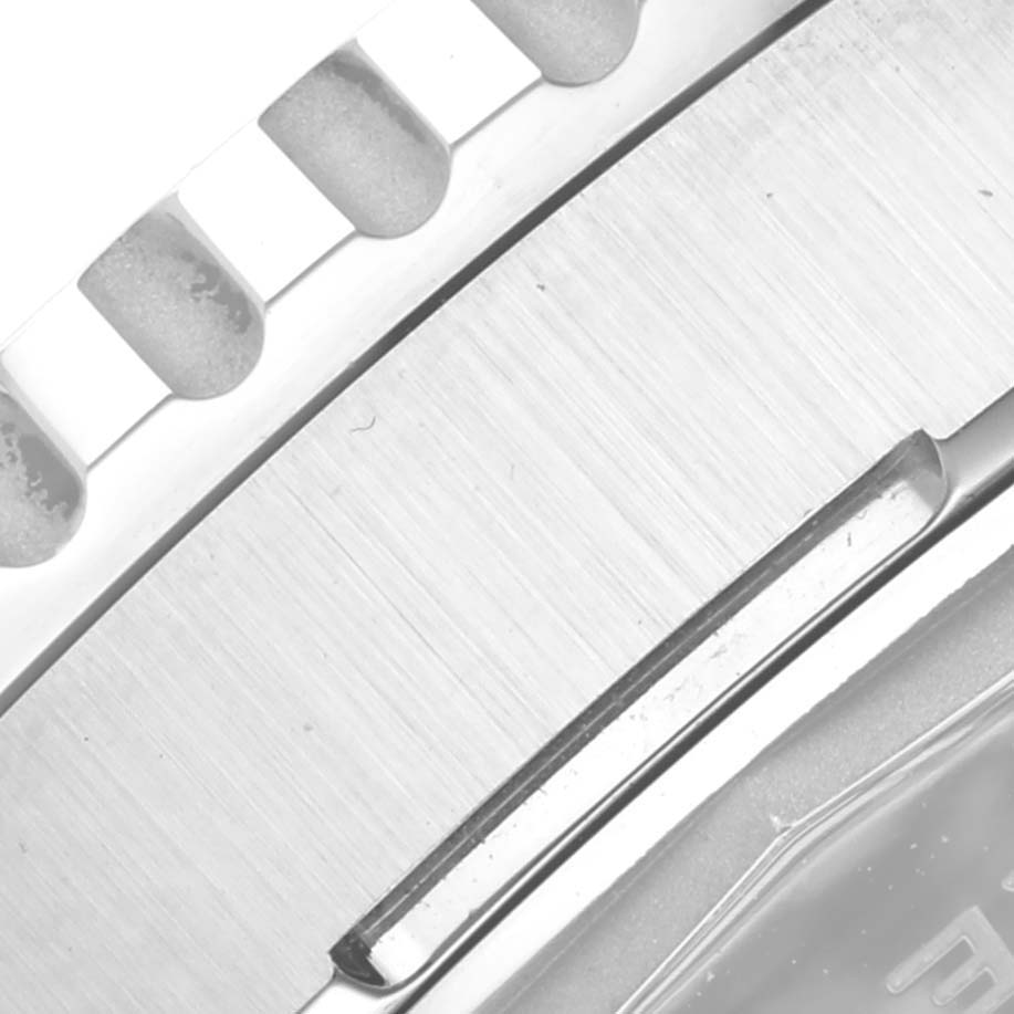 The image shows a close-up of the bezel edge and part of the bracelet of the Breitling Navitimer AB0137 Men
s Stainless Steel Blue Dial AB0137 Men
s Stainless Steel Blue Dial watch.