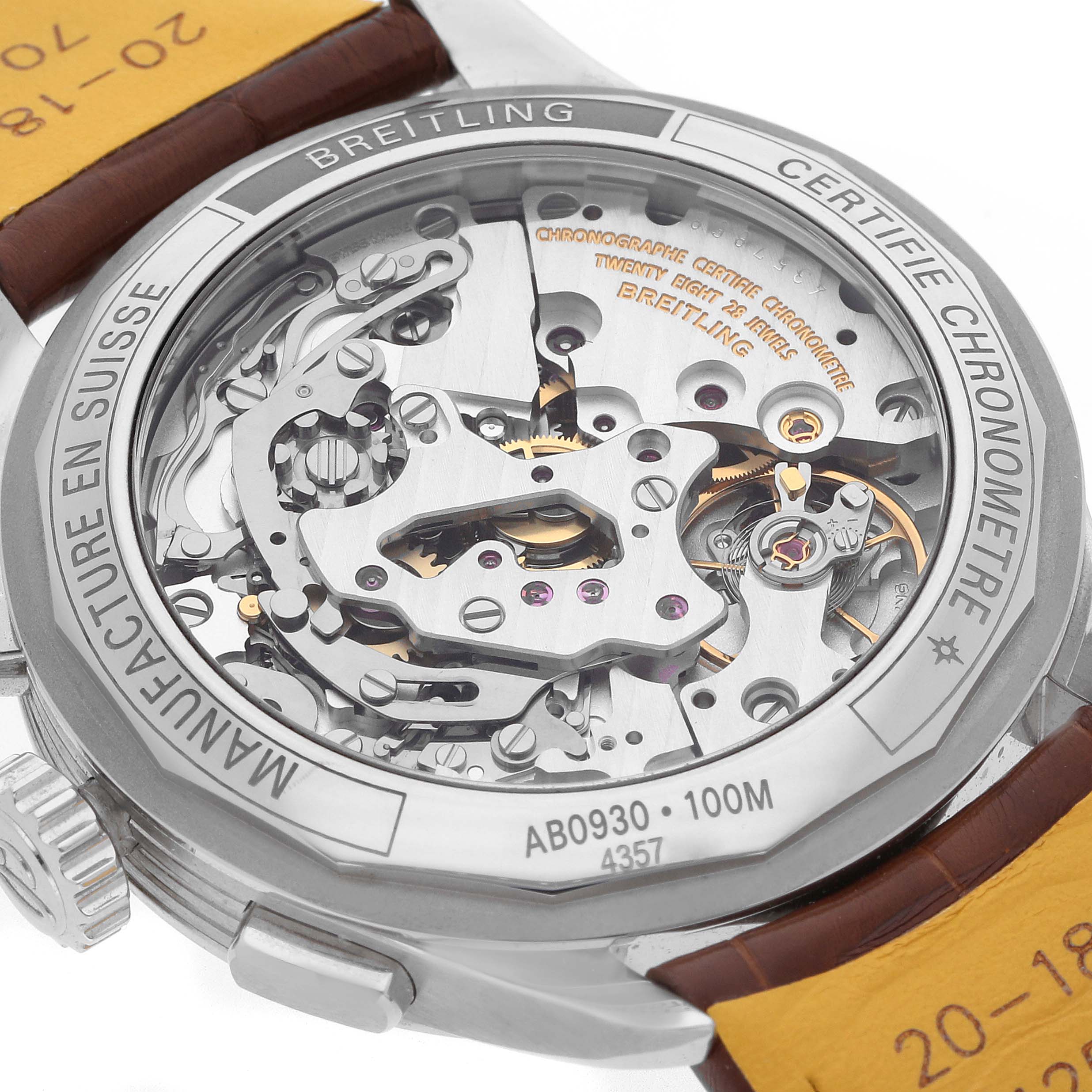 The image shows the back of a Breitling Premier AB0930 Men
s Stainless Steel Green Dial model, highlighting the intricate movement and internal mechanics.