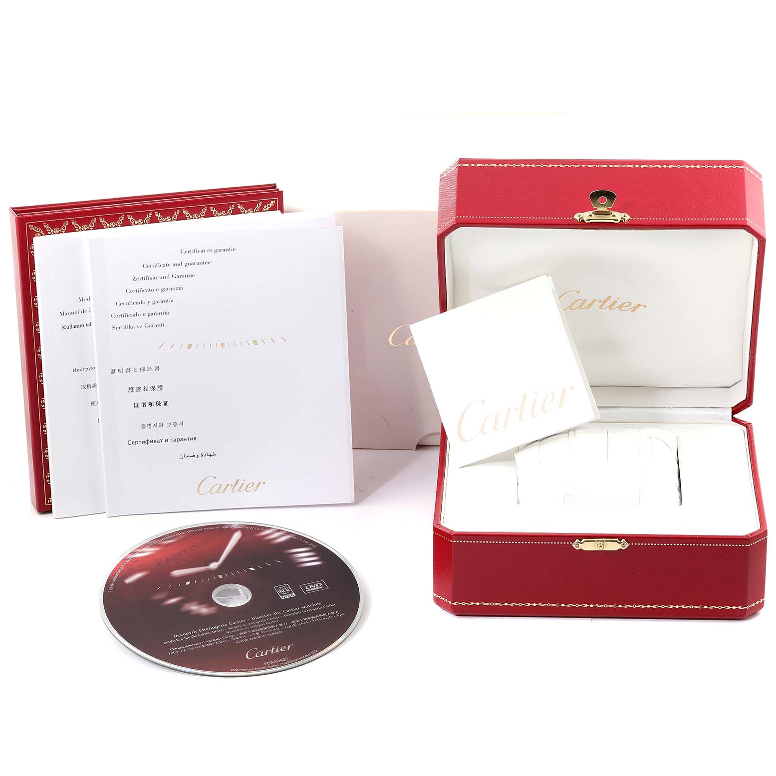 This image shows the packaging and accessories, including the box, booklets, and CD, for the Calibre de Cartier model by Cartier.